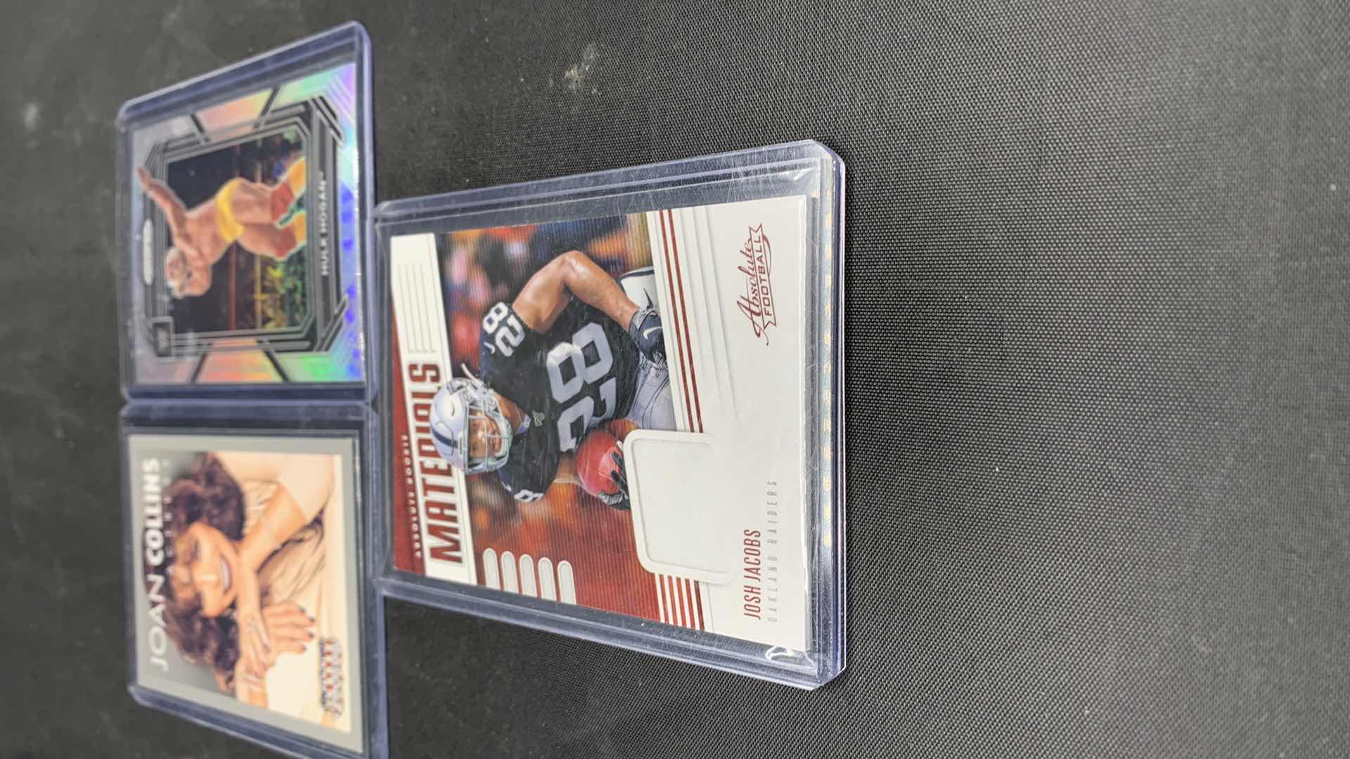 Photo 1 of SPORTS CARDS: JOSH JACOBS LAS VEGAS RAIDERS UNIFORM SWATCH, HULK HOGAN REFRACTOR 