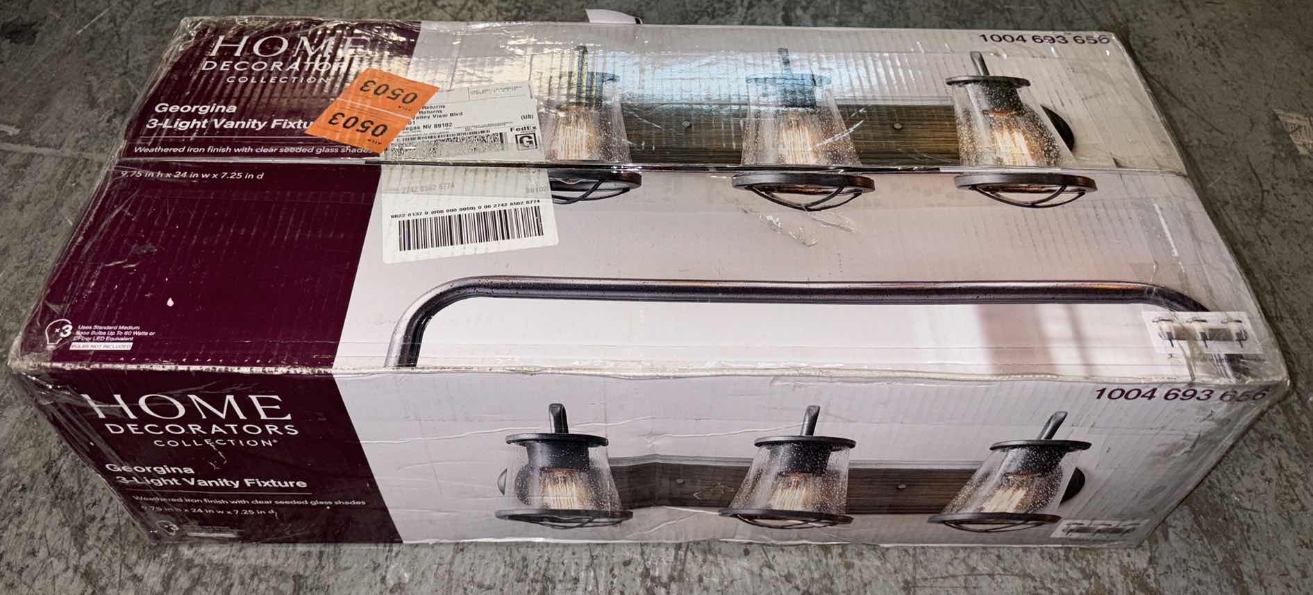 Photo 1 of HOME DECORATORS COLLECTION WEATHERED IRON FINISH & CLEAR SEEDED GLASS SHADES GEORGINA 3-LIGHT VANITY FIXTURE 1004 693 656