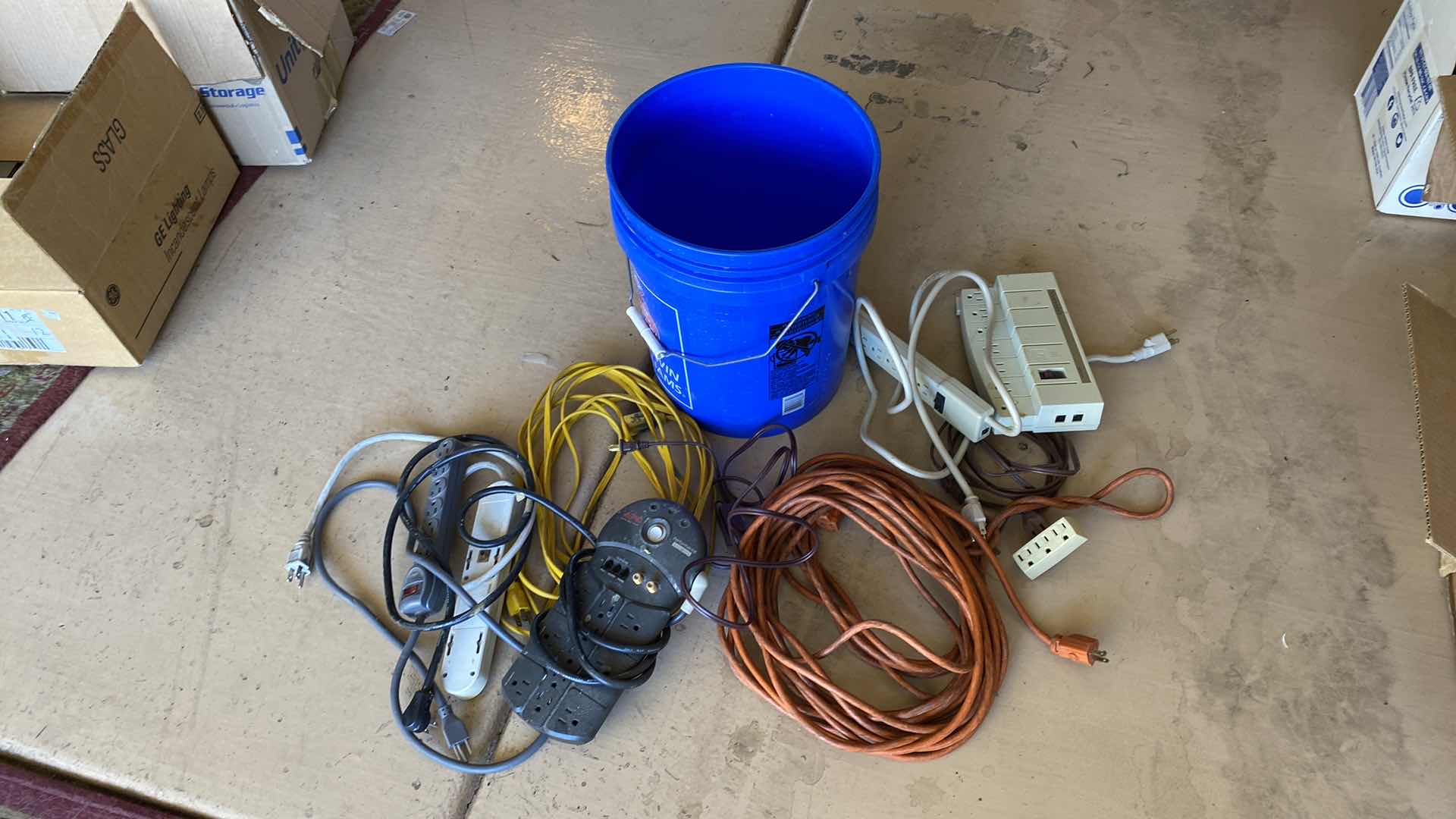 Photo 1 of BUCKET WITH ELECTRICAL CORDS AND SURGE PROTECTORS