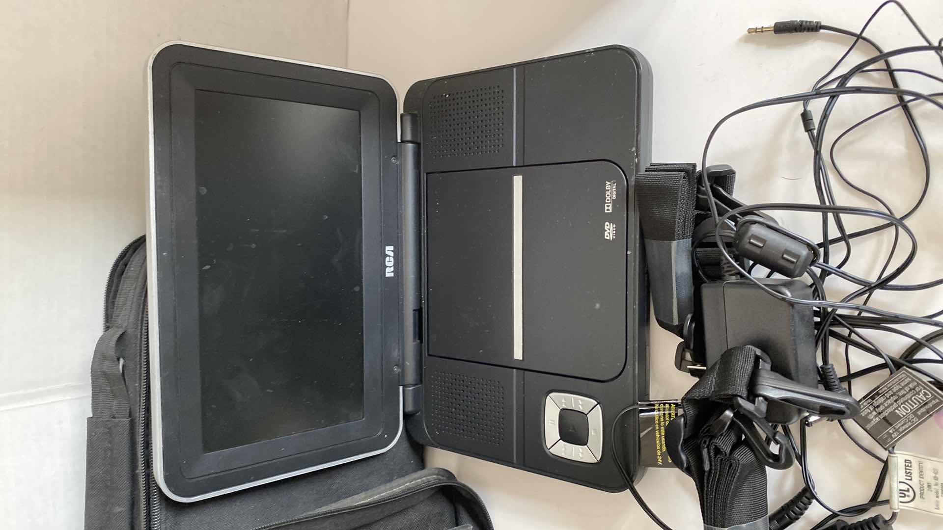 Photo 1 of RCA DVD PLAYER WITH CORDS REMOTE AND CASE WITH CSI MIAMI DVDS