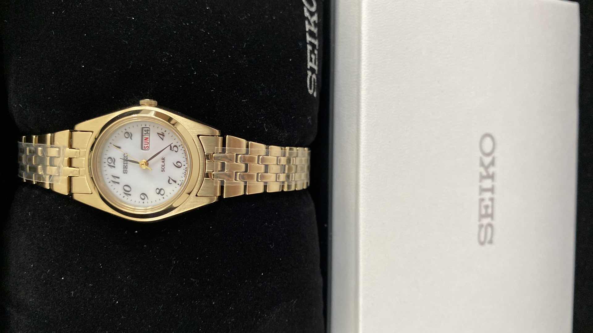 View 2 of WOMENS SEIKO GOLD TONE WATCH SUT118 IN BOX DAYS ARE RED WRITING