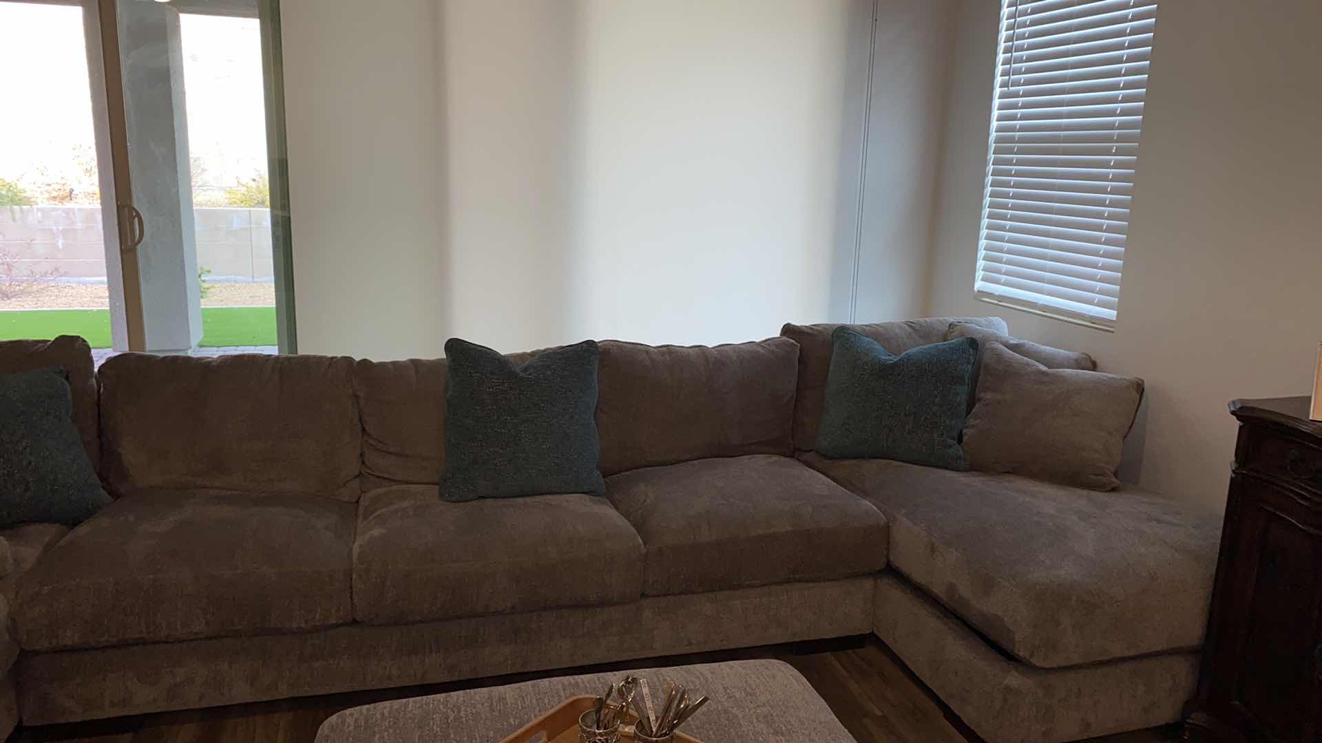 Photo 1 of 11’ 7” X 14” 3” ( CHAISE IS 64”) ASHLEY SILVER FABRIQUE SECTIONAL WITH CHAISE AND OTTOMAN