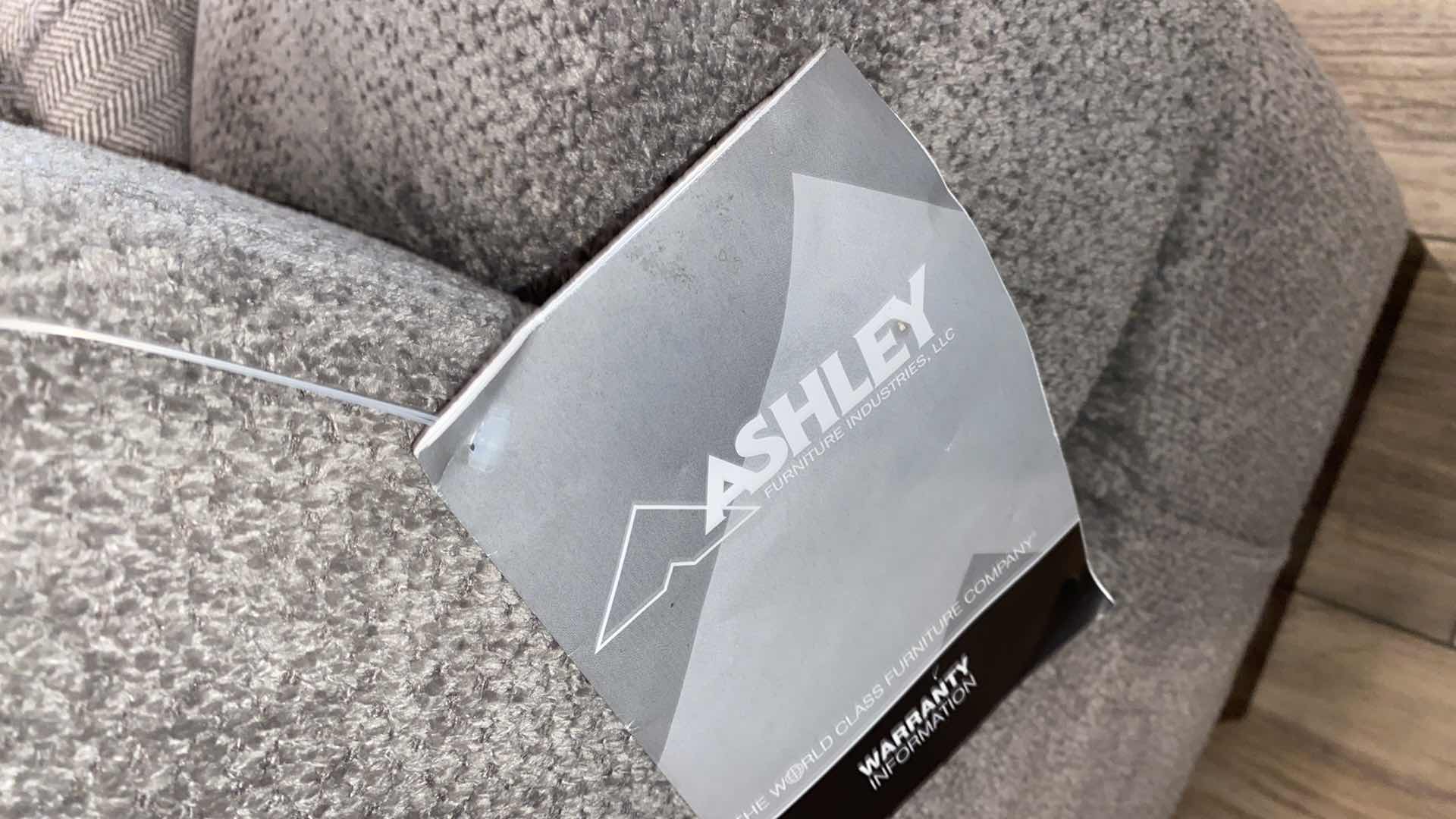 Photo 1 of 11’ 7” X 14” 3” ( CHAISE IS 64”) ASHLEY SILVER FABRIQUE SECTIONAL WITH CHAISE AND OTTOMAN