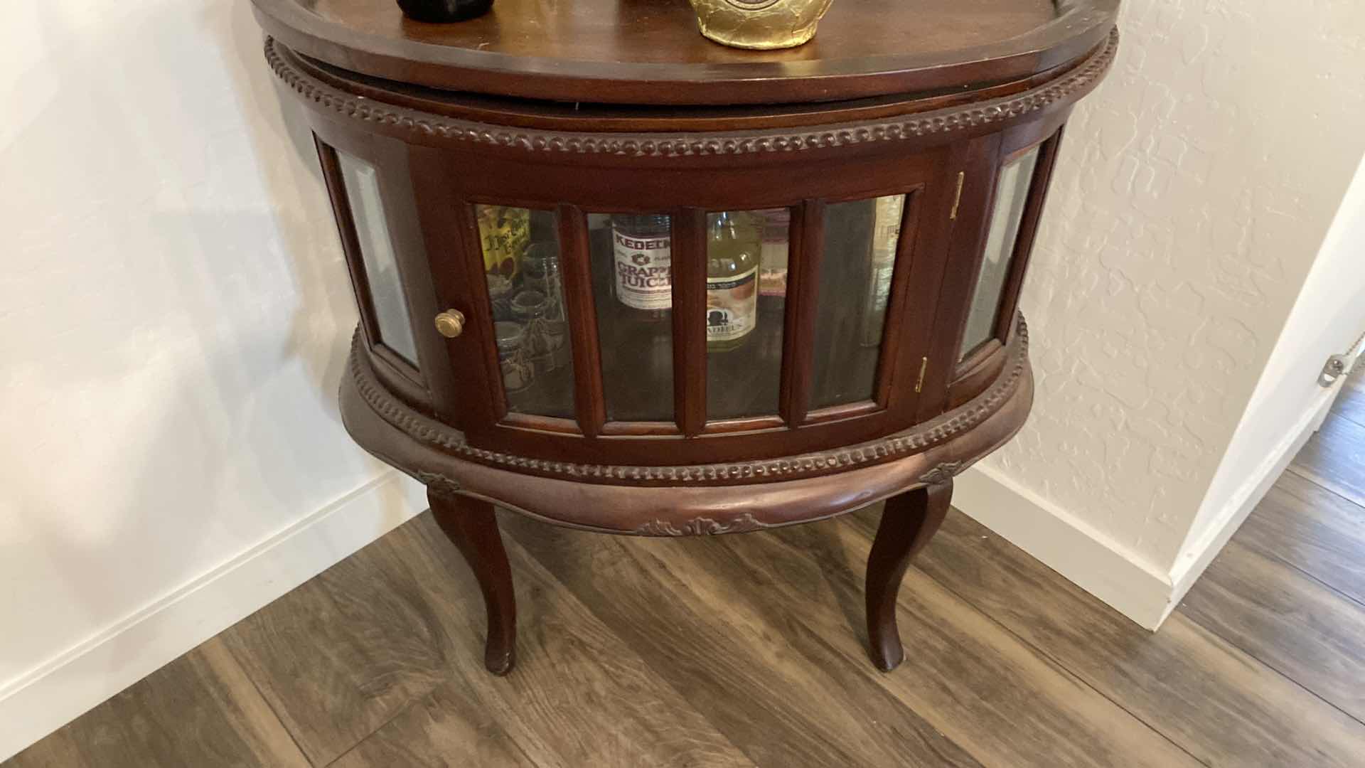 View 3 of OVAL WOOD CABINET WITH BEVELED GLASS 29“ x 19 1/2“ H 31” contents, not included