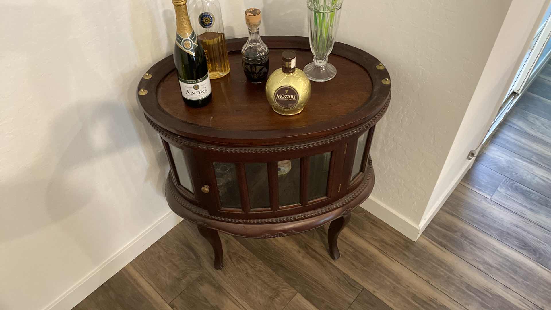 View 2 of OVAL WOOD CABINET WITH BEVELED GLASS 29“ x 19 1/2“ H 31” contents, not included