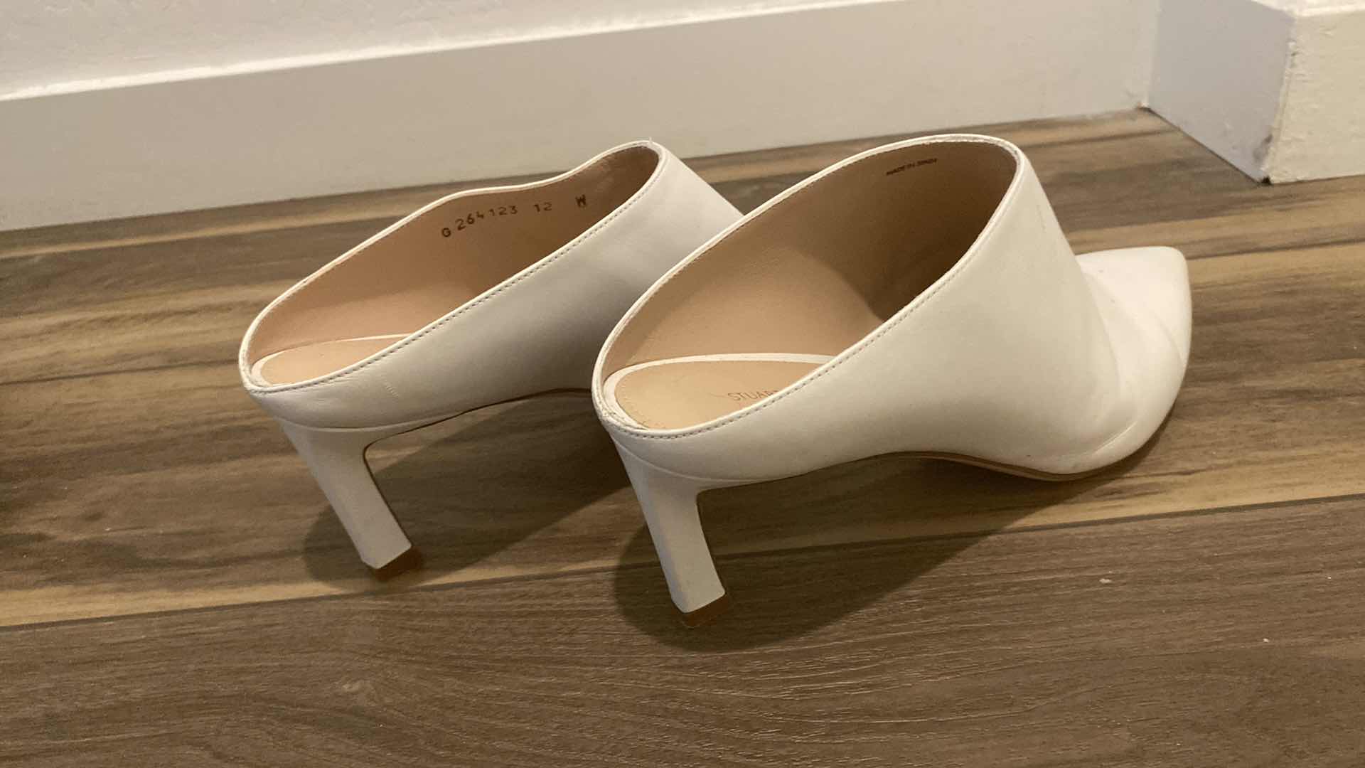 Photo 1 of WOMENS SIZE 12W STUART WEITZMAN MIRA CREAM COLOR MULES