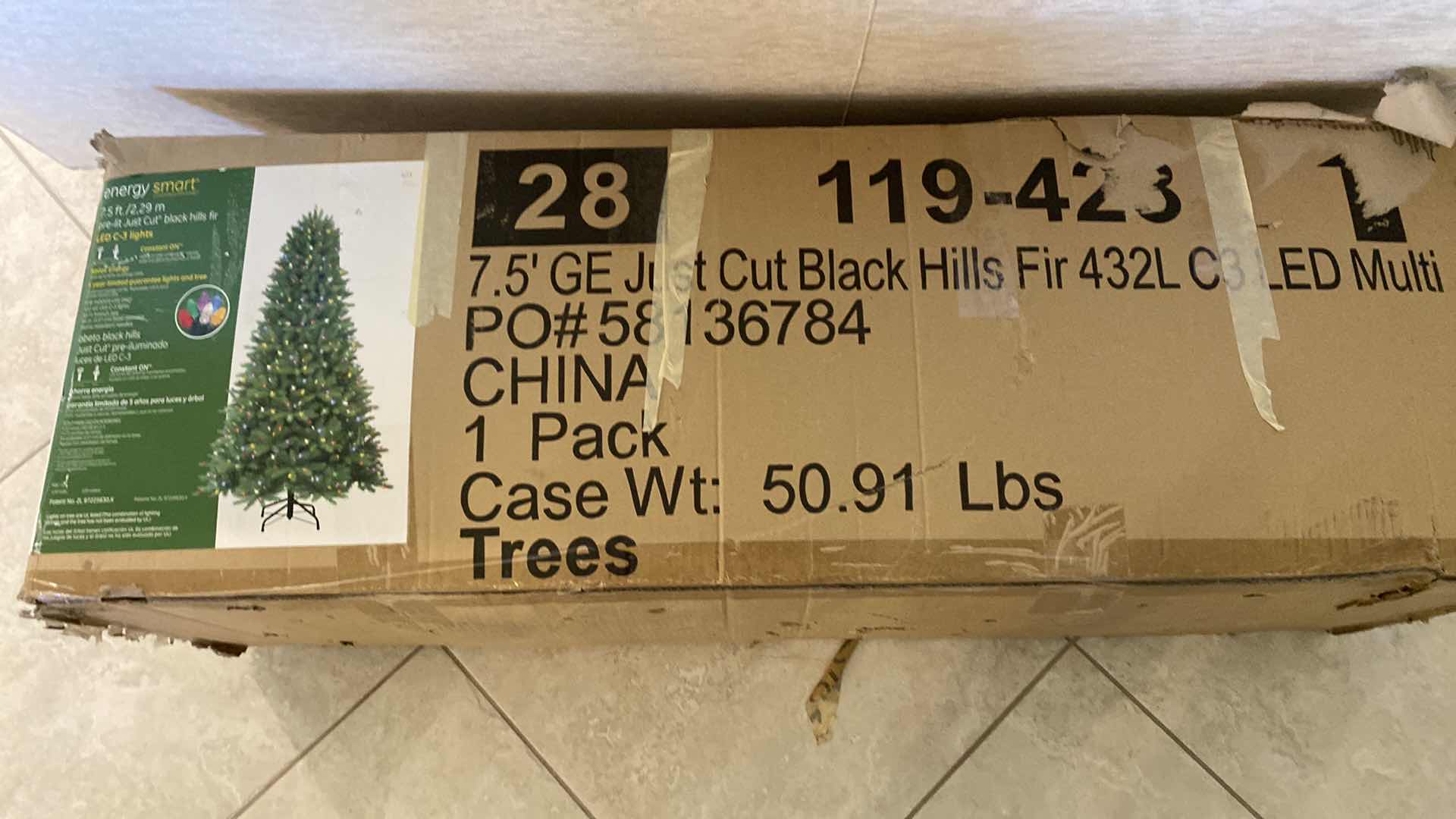 Photo 1 of ENERGY SMART 7.5’ LED MULTI COLOR LIGHT JUST CUT BLACK HILLS FIR TREE