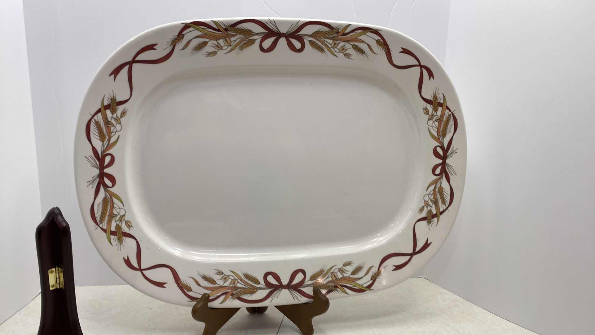 Photo 1 of 2 CERAMIC ROUND PLATTERS AND PLASTIC PLATTER BASKET