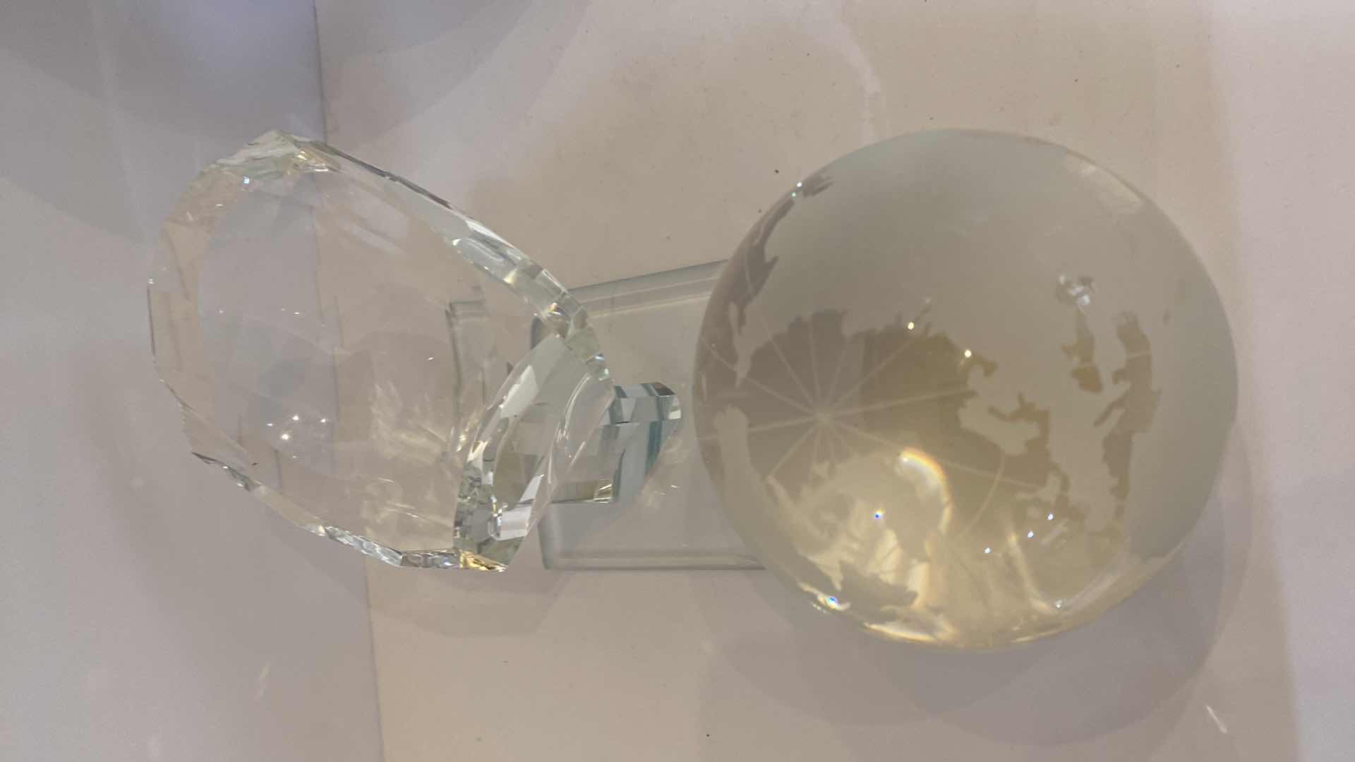 Photo 1 of CRYSTAL GLOBE IN HAND 4” ON CRYSTAL STAND OVERALL HEIGHT 7”