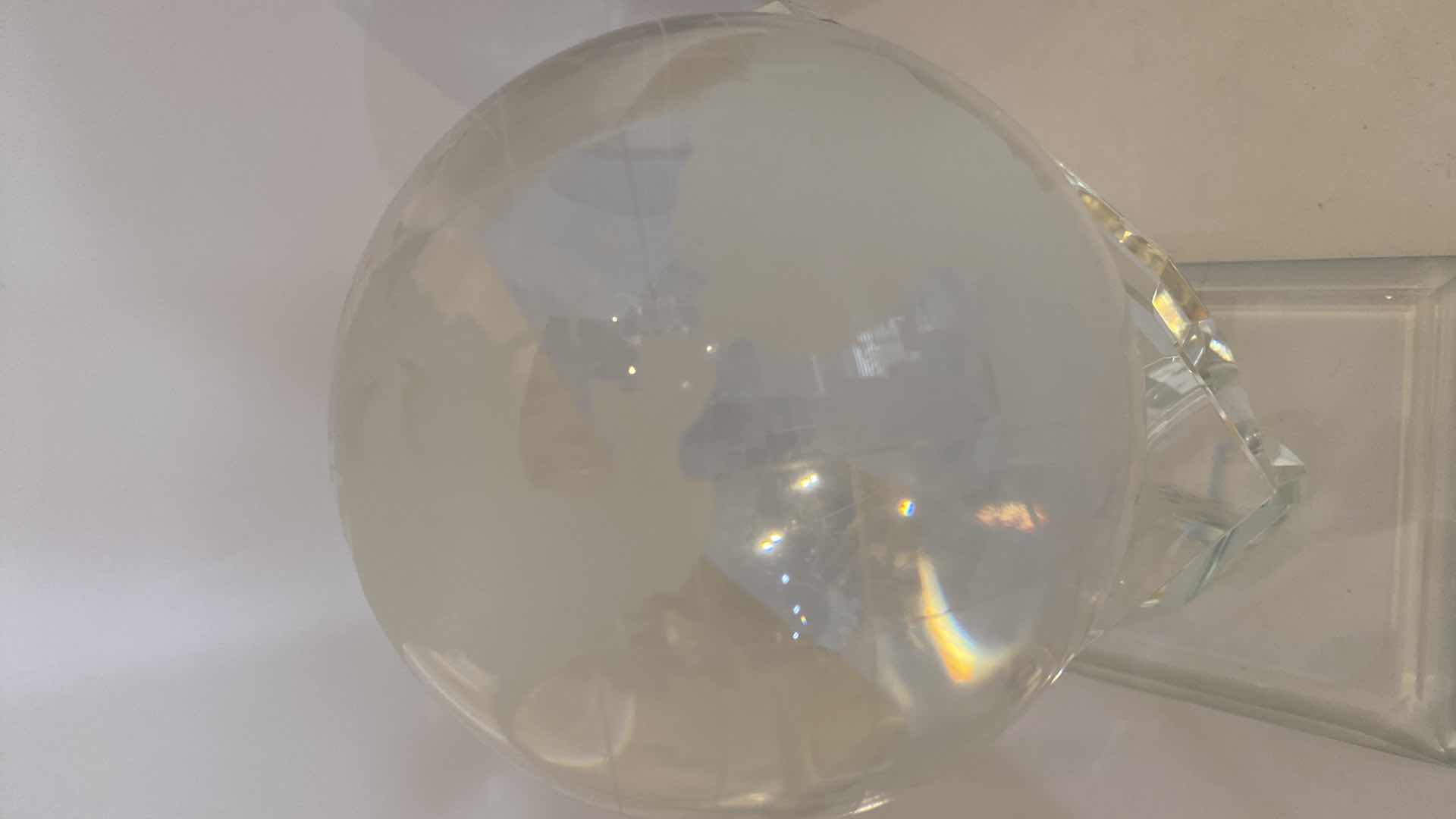 Photo 1 of CRYSTAL GLOBE IN HAND 4” ON CRYSTAL STAND OVERALL HEIGHT 7”