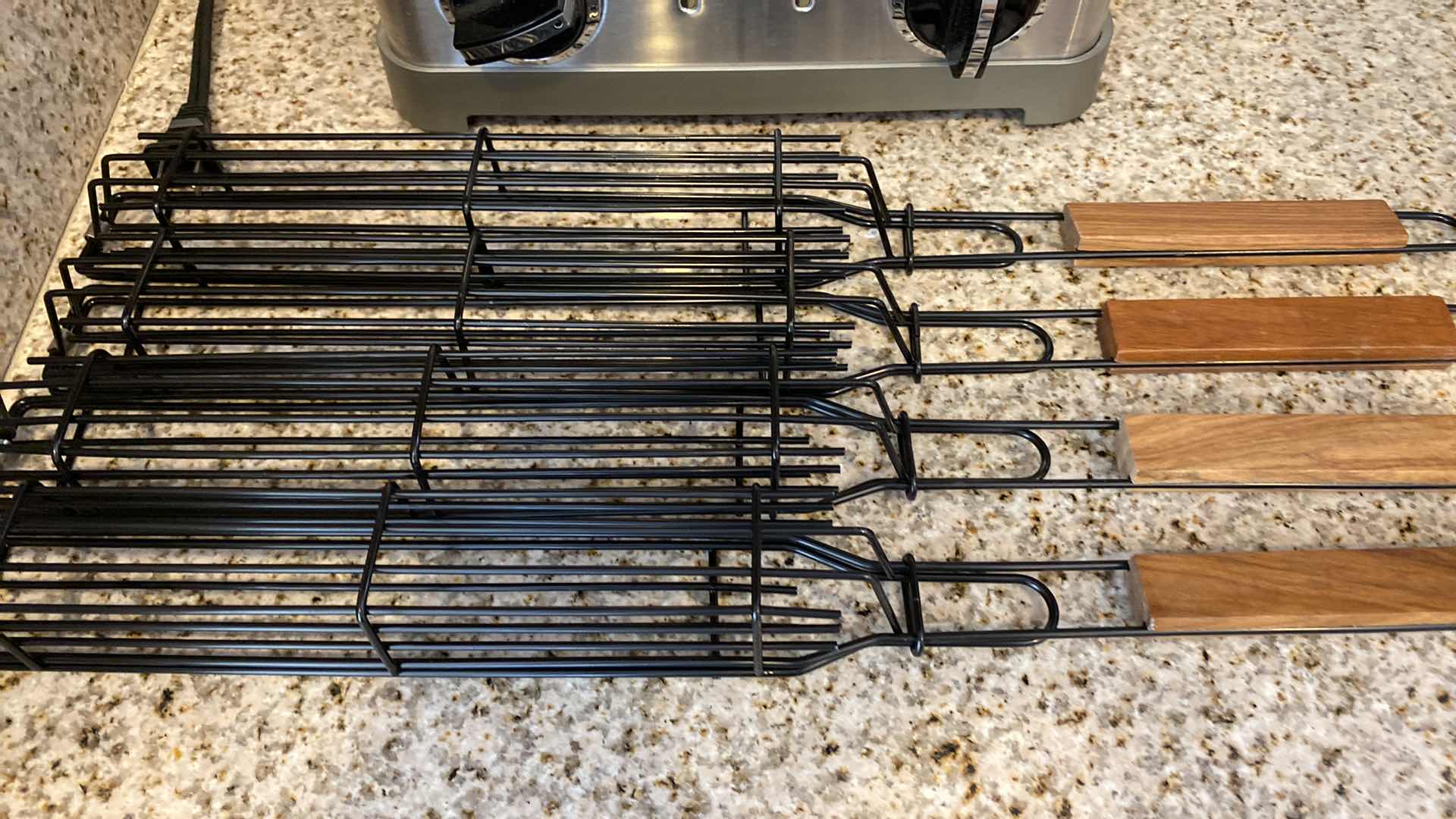 Photo 1 of CONTENTS OF CABINET BBQ TOOLS AND CUISINART 4 SLICE TOASTER