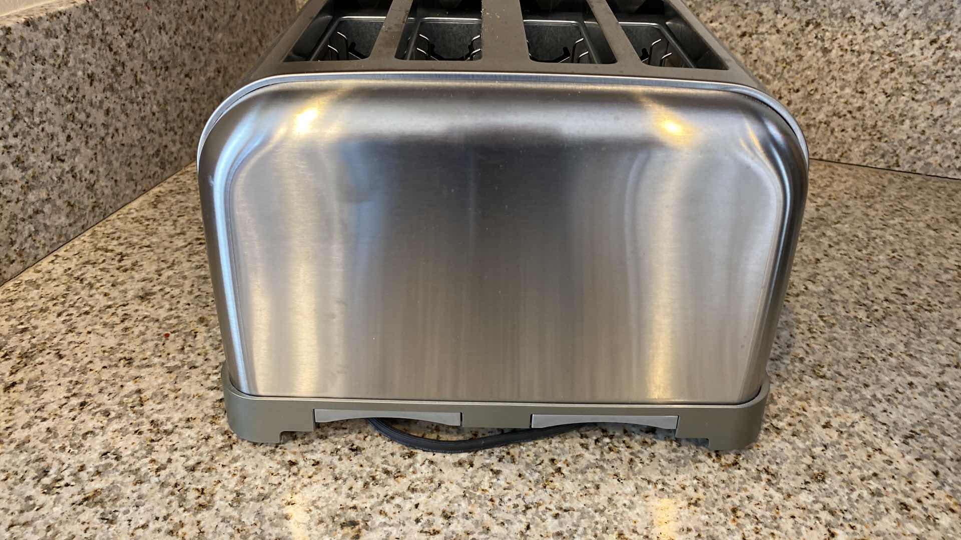 Photo 1 of CONTENTS OF CABINET BBQ TOOLS AND CUISINART 4 SLICE TOASTER