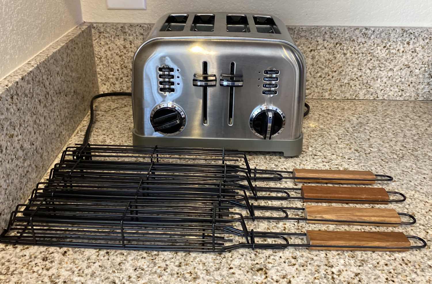 Photo 1 of CONTENTS OF CABINET BBQ TOOLS AND CUISINART 4 SLICE TOASTER