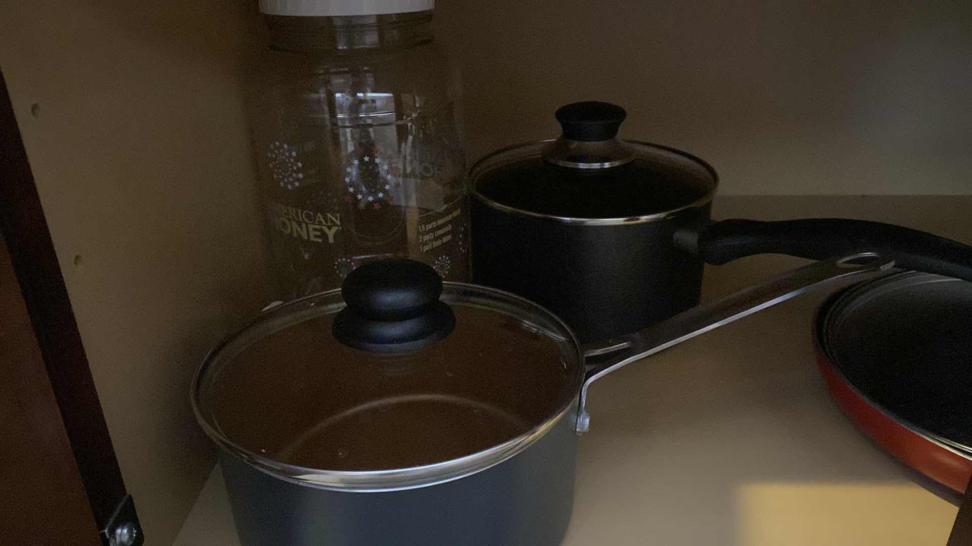 Photo 1 of CONTENTS KITCHEN CABINET POTS AND PANS