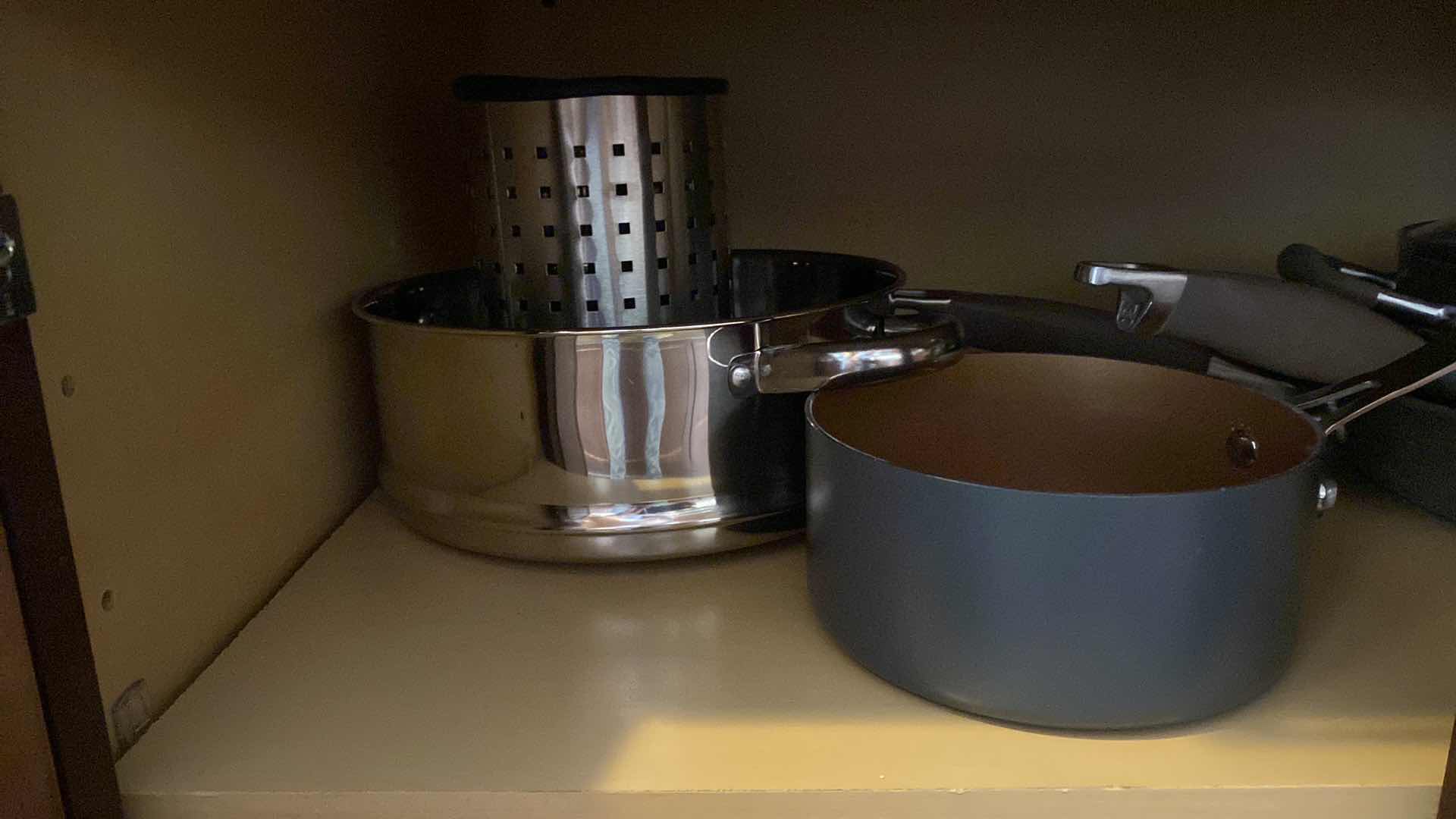 Photo 1 of CONTENTS KITCHEN CABINET POTS AND PANS