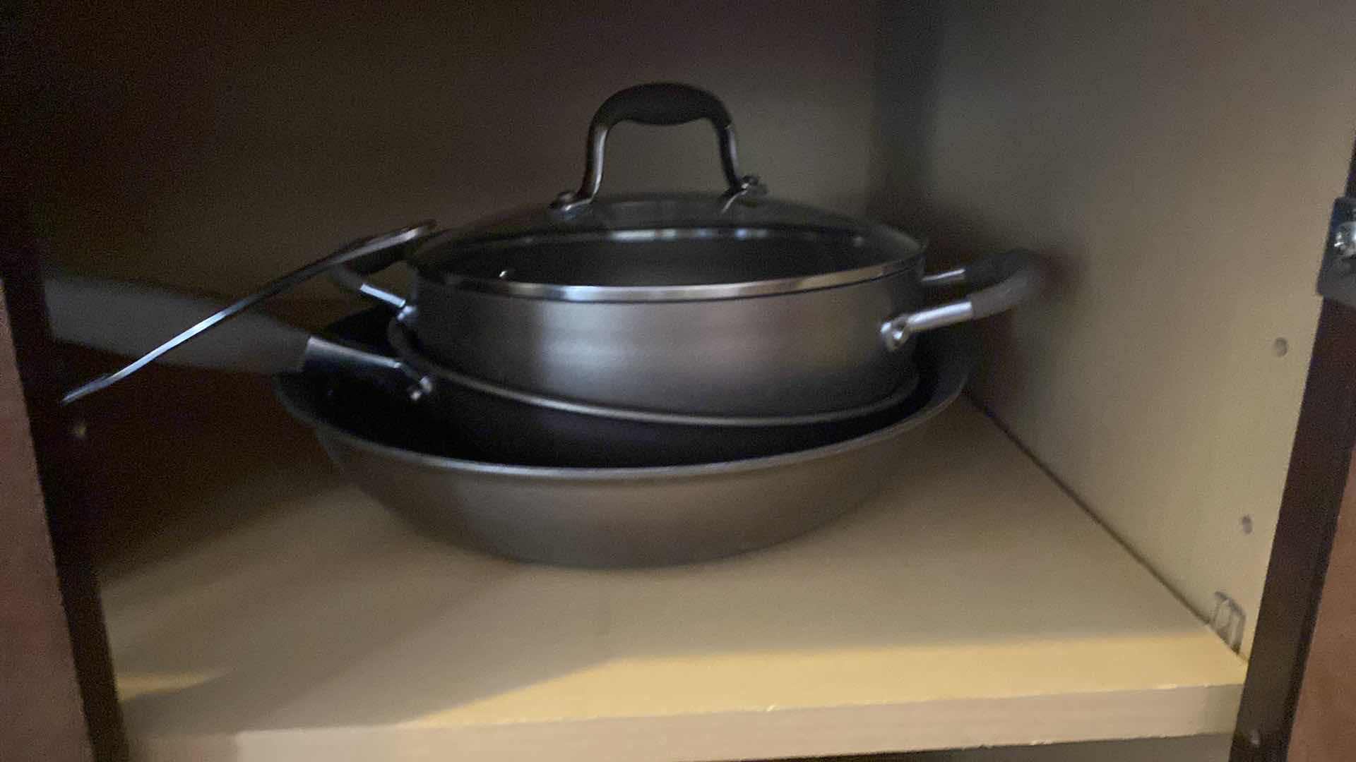 Photo 1 of CONTENTS KITCHEN CABINET POTS AND PANS