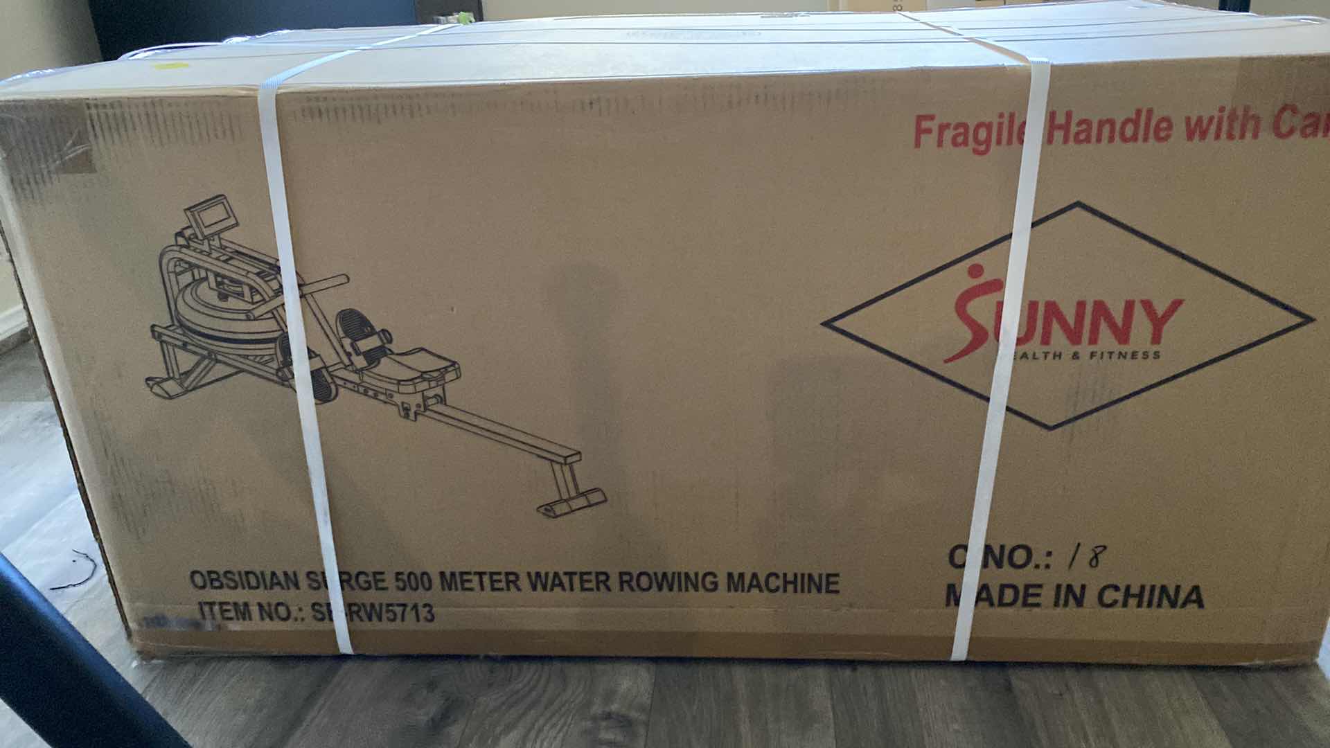 Photo 1 of NEW IN BOX Sunny Health & Fitness Water Rowing Machine, Indoor Exercise Plus Optional Connected Fitness with SunnyFit® App and Wooden Smart Foldable