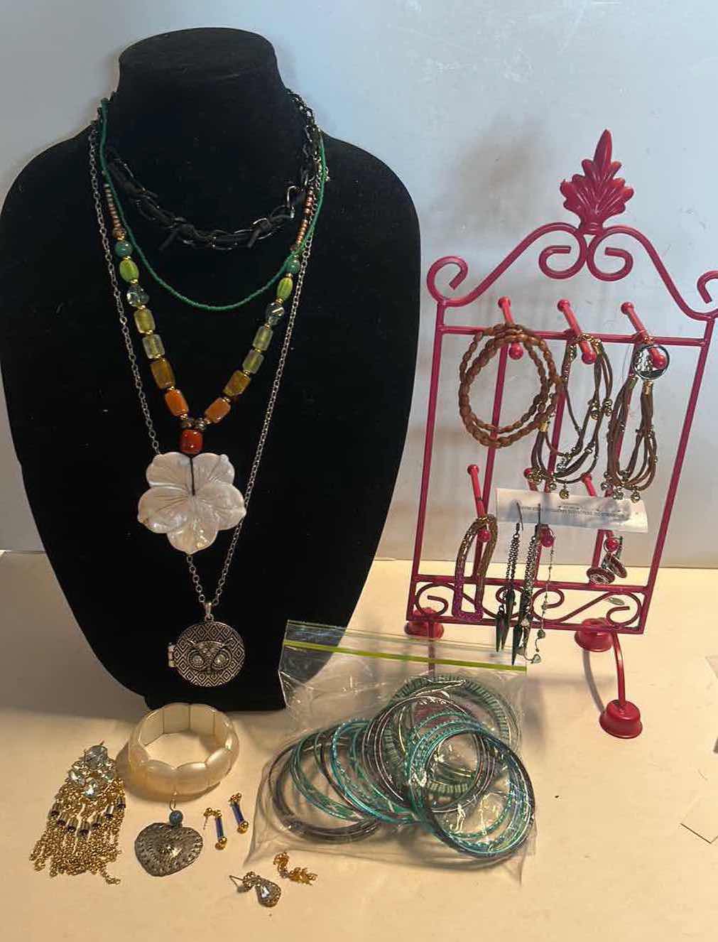 Photo 1 of JEWELRY ASSORTMENT WITH PINK STAND