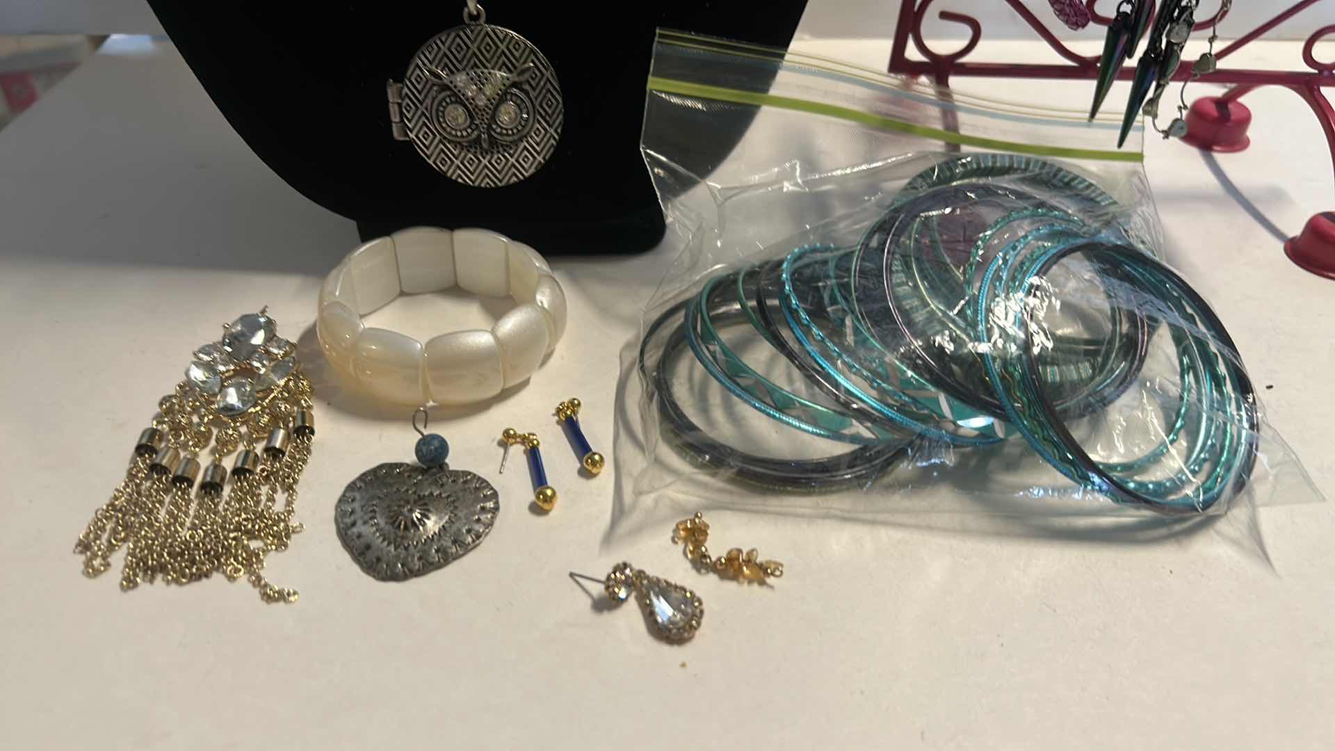 Photo 1 of JEWELRY ASSORTMENT WITH PINK STAND