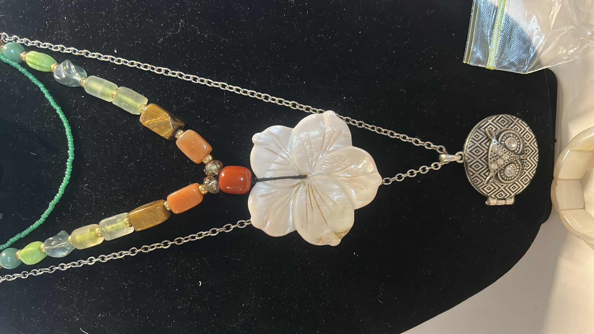 Photo 1 of JEWELRY ASSORTMENT WITH PINK STAND