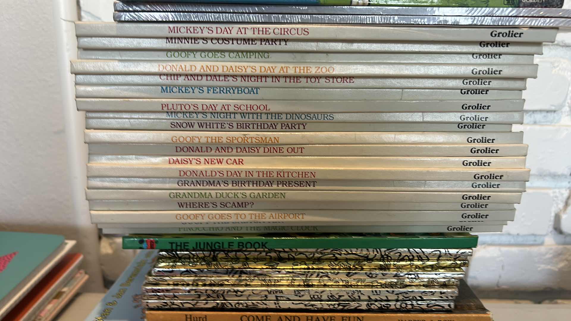 Photo 1 of CHILDRENS BOOK ASSORTMENT (MOSTLY DISNEY) AND STUFFED ANIMAL- 