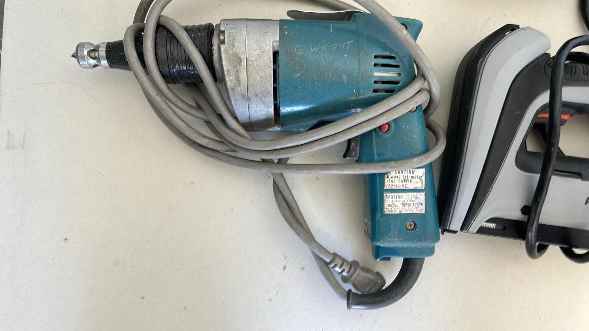 Photo 2 of GARAGE TOOLS: DRILL, STAPLE GUN AND KNEE PADS