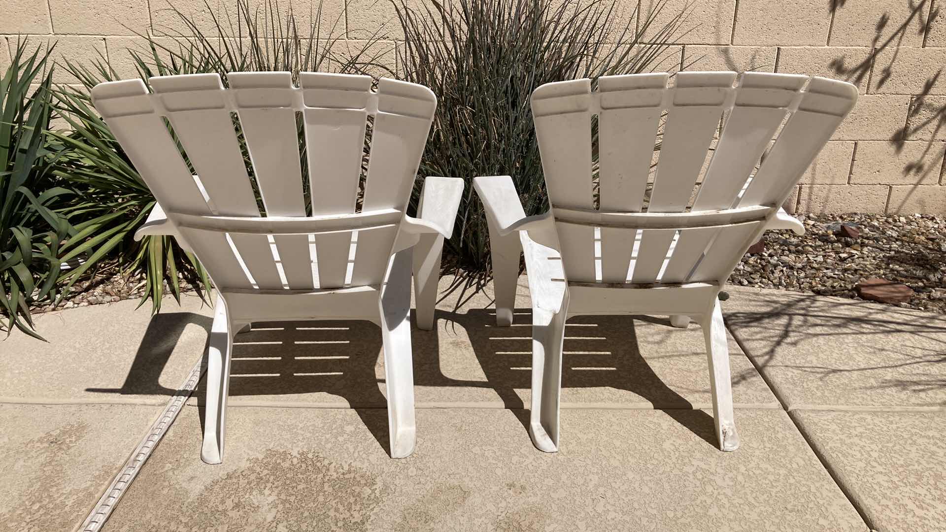 Photo 1 of OUTDOOR PATIO PLASTIC CHAIRS (2) 30.5” X 29” H35.5”
