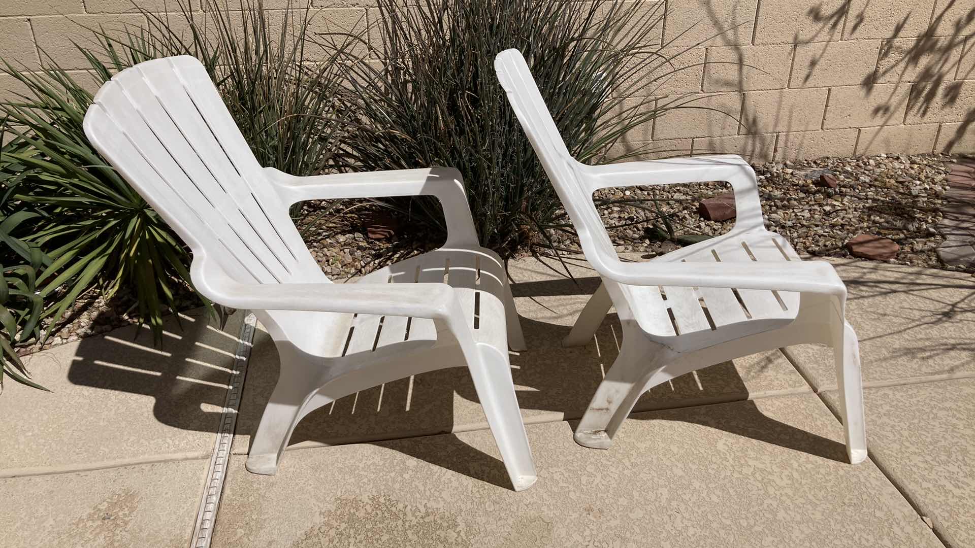 Photo 1 of OUTDOOR PATIO PLASTIC CHAIRS (2) 30.5” X 29” H35.5”
