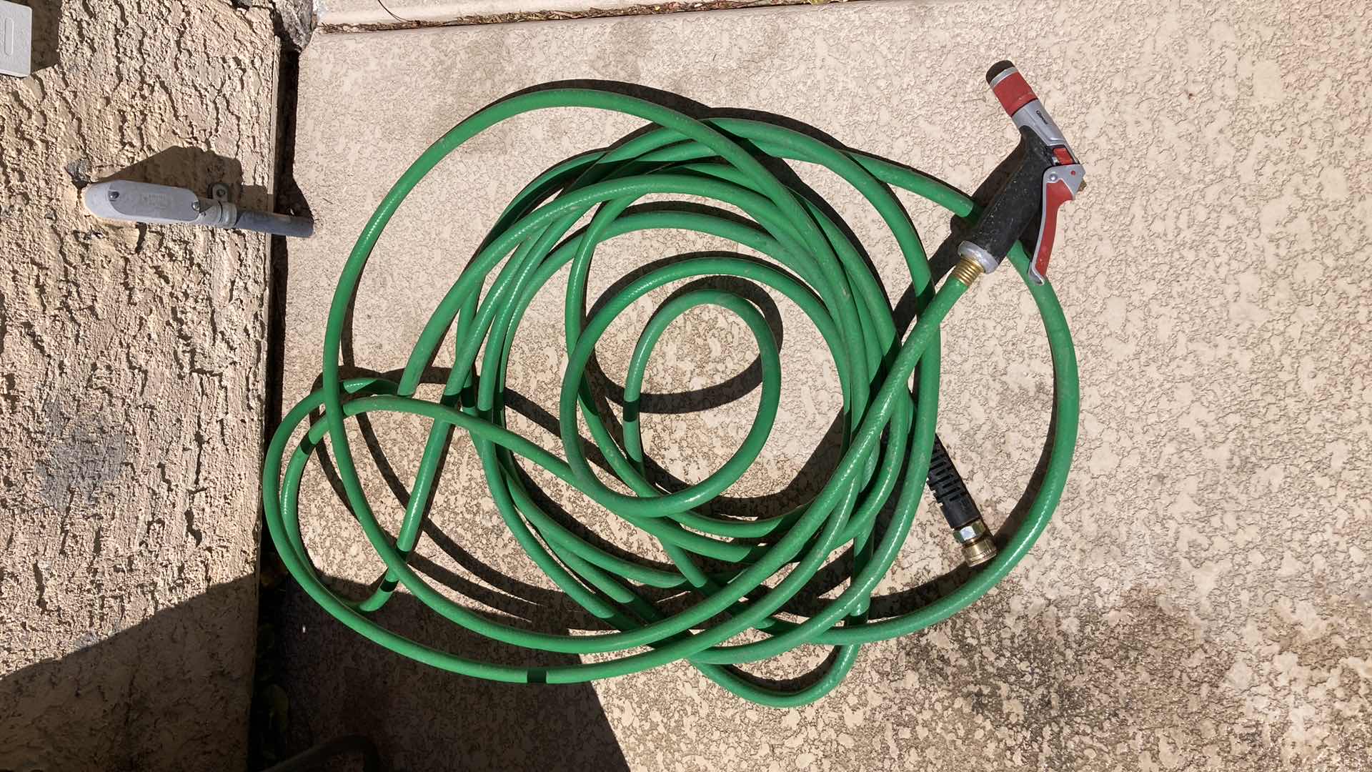 Photo 1 of SUNCAST OUTDOOR HOSE STORAGE W BLACK HOSE (APPROX 50’)& GREEN HOSE (APPROX 50’)