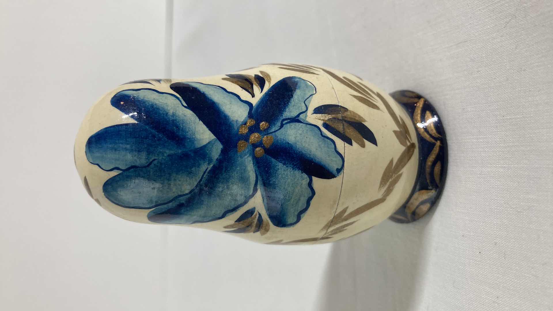 Photo 1 of HAND PAINTED NESTING DOLL H3.5