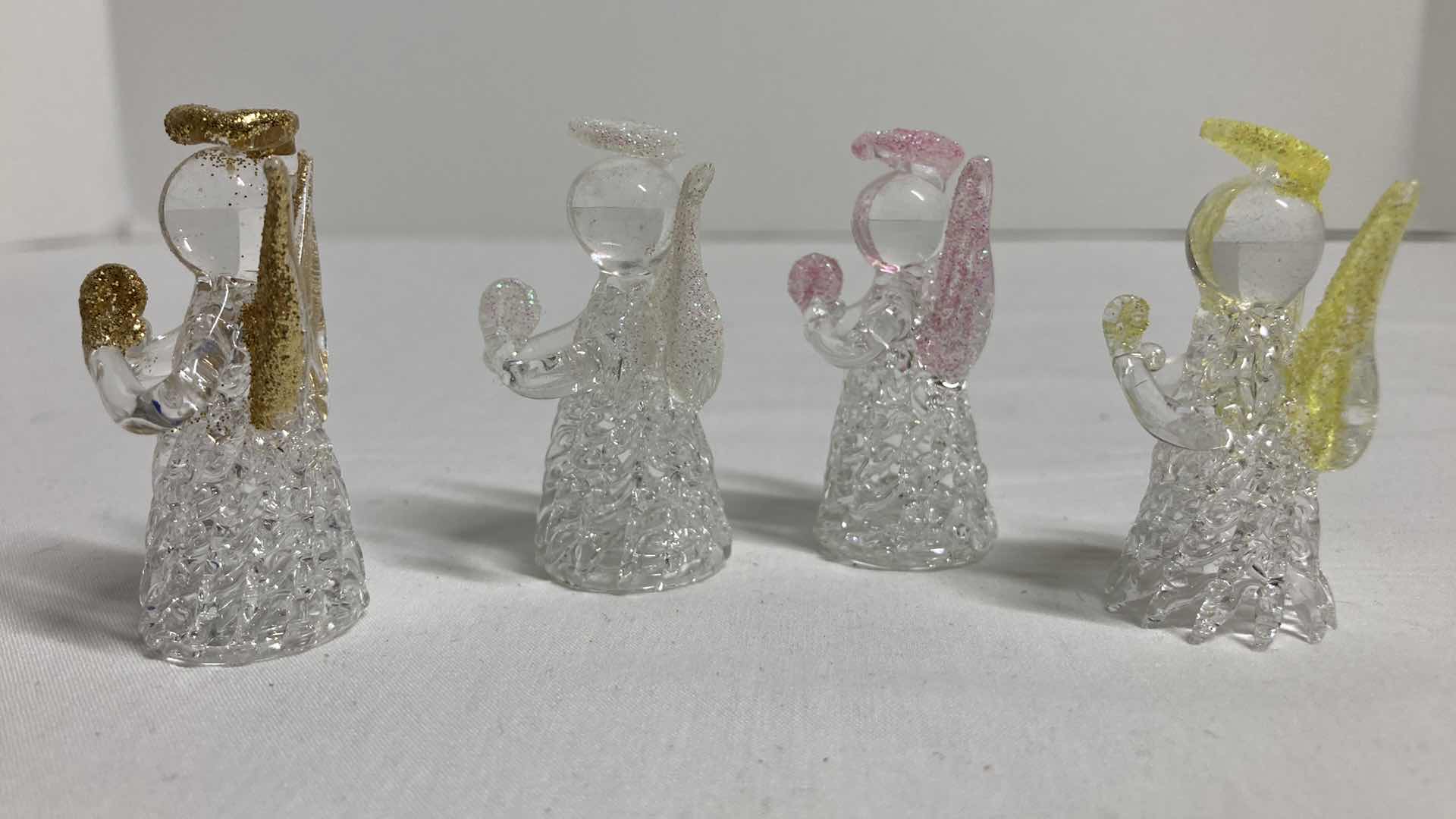 Photo 1 of GLASS ANGEL FIGURINES (4) H2”