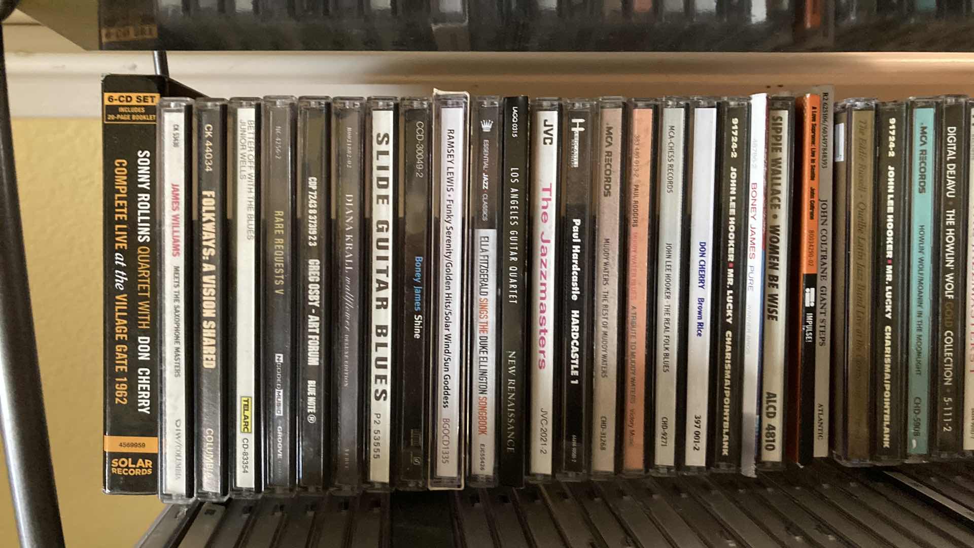 Photo 1 of JAZZ & BLUES MUSIC CD’S (APPROX 200) W METAL RACK 19.25” X 13.25” H35.5”