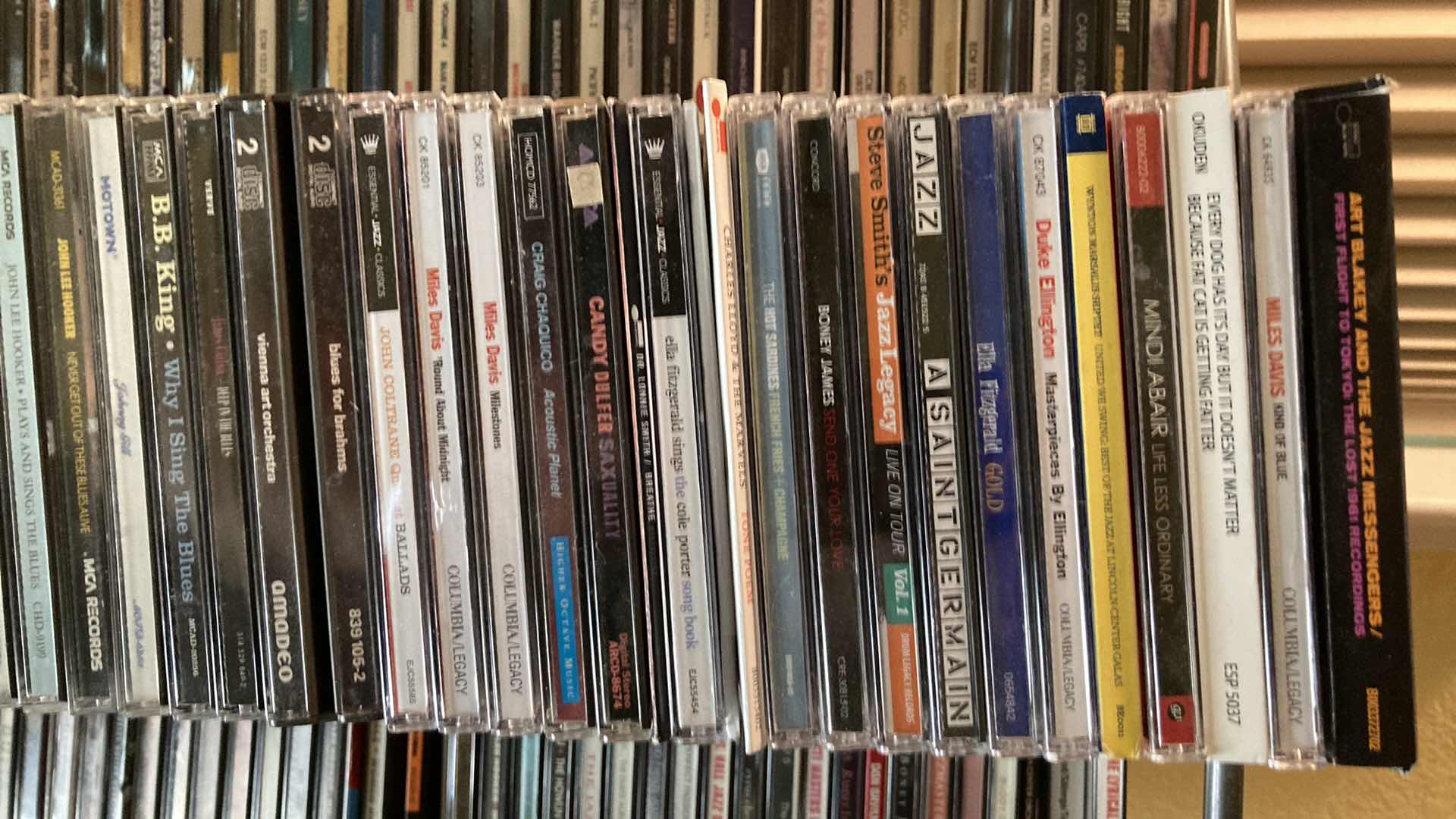 Photo 1 of JAZZ & BLUES MUSIC CD’S (APPROX 200) W METAL RACK 19.25” X 13.25” H35.5”