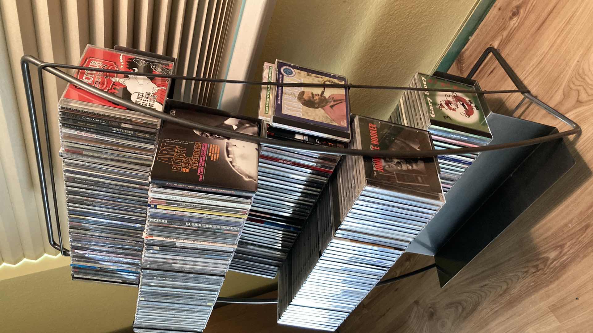 Photo 1 of JAZZ & BLUES MUSIC CD’S (APPROX 200) W METAL RACK 19.25” X 13.25” H35.5”
