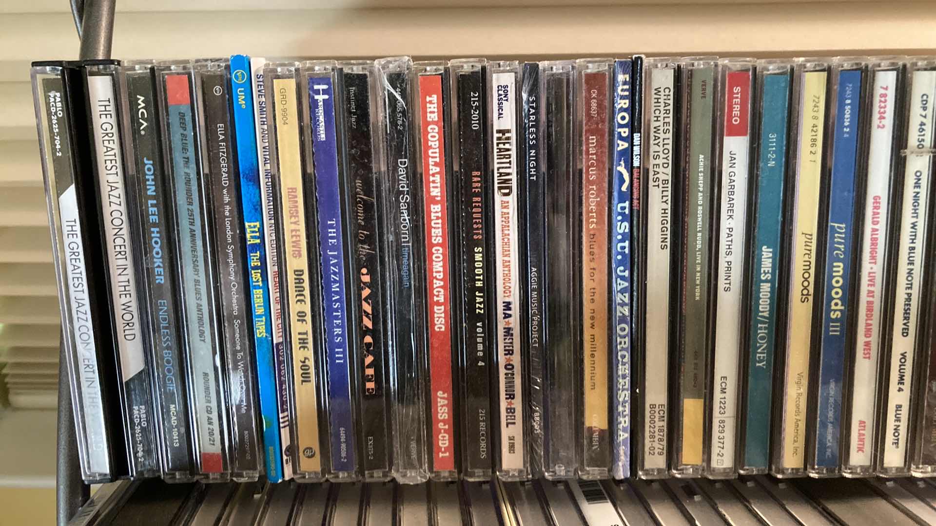 Photo 1 of JAZZ & BLUES MUSIC CD’S (APPROX 200) W METAL RACK 19.25” X 13.25” H35.5”