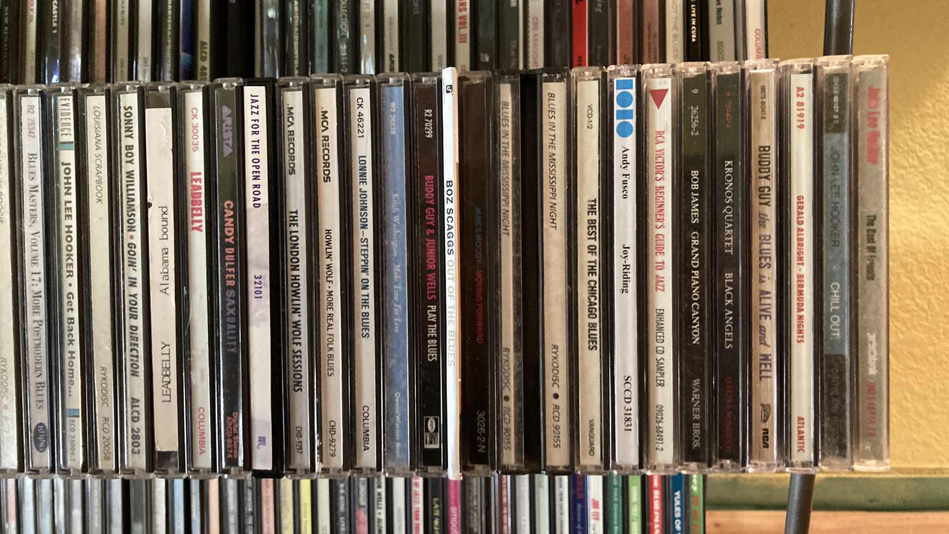 Photo 1 of JAZZ & BLUES MUSIC CD’S (APPROX 200) W METAL RACK 19.25” X 13.25” H35.5”