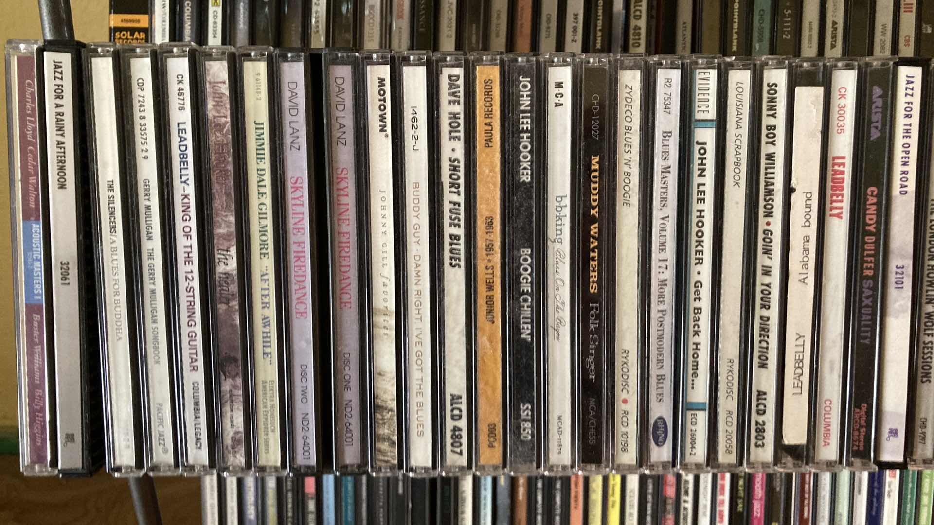 Photo 1 of JAZZ & BLUES MUSIC CD’S (APPROX 200) W METAL RACK 19.25” X 13.25” H35.5”