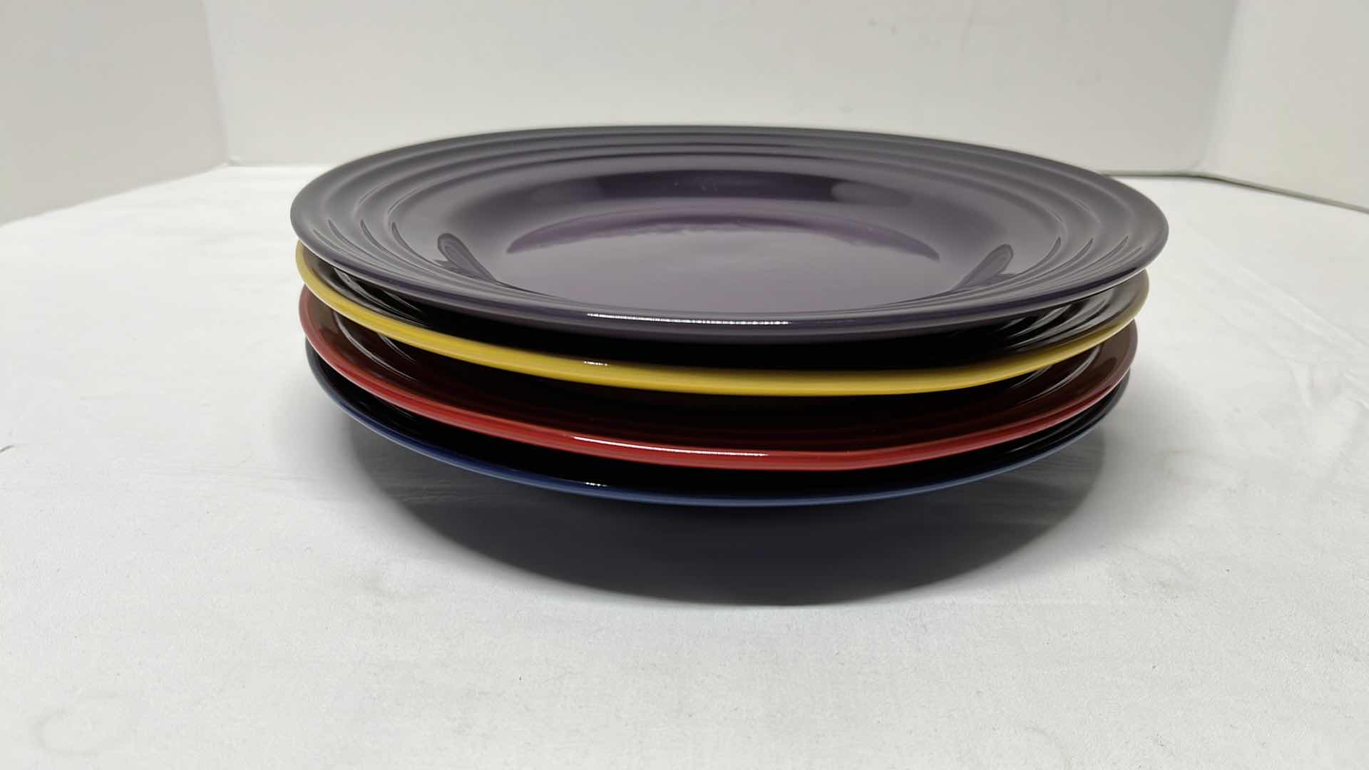 Photo 1 of LE CREUSET STONEWARE SET OF 4 DINNER PLATES, 10”