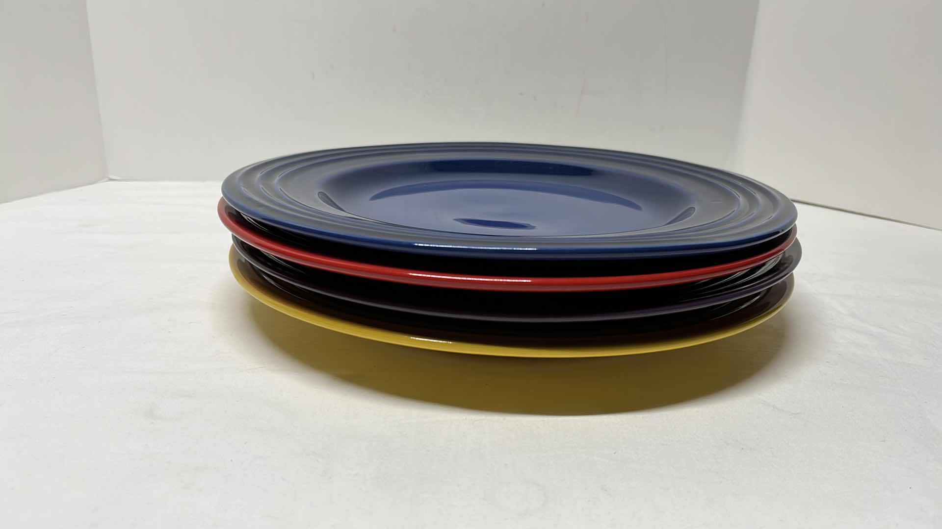 Photo 1 of LE CREUSET STONEWARE SET OF 4 DINNER PLATES, 12”