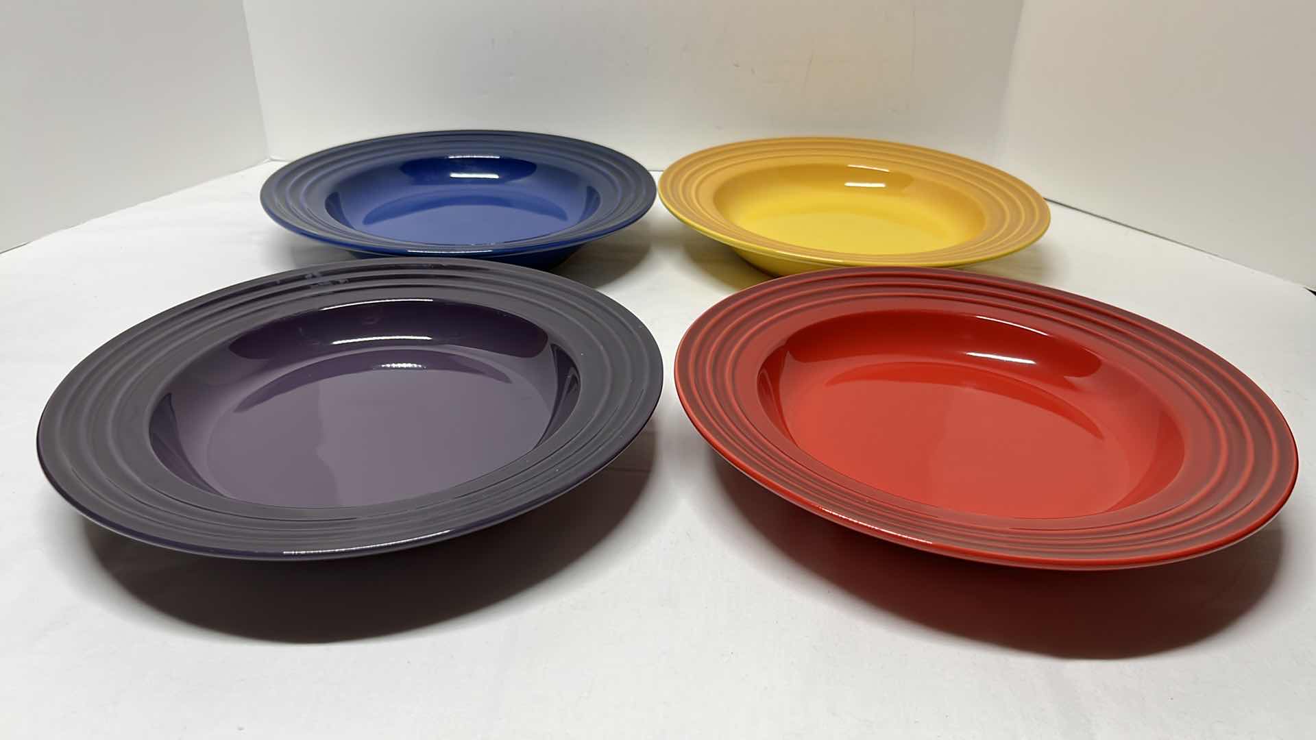 Photo 1 of LE CREUSET STONEWARE SET OF 4 SOUP BOWLS, 10.5”