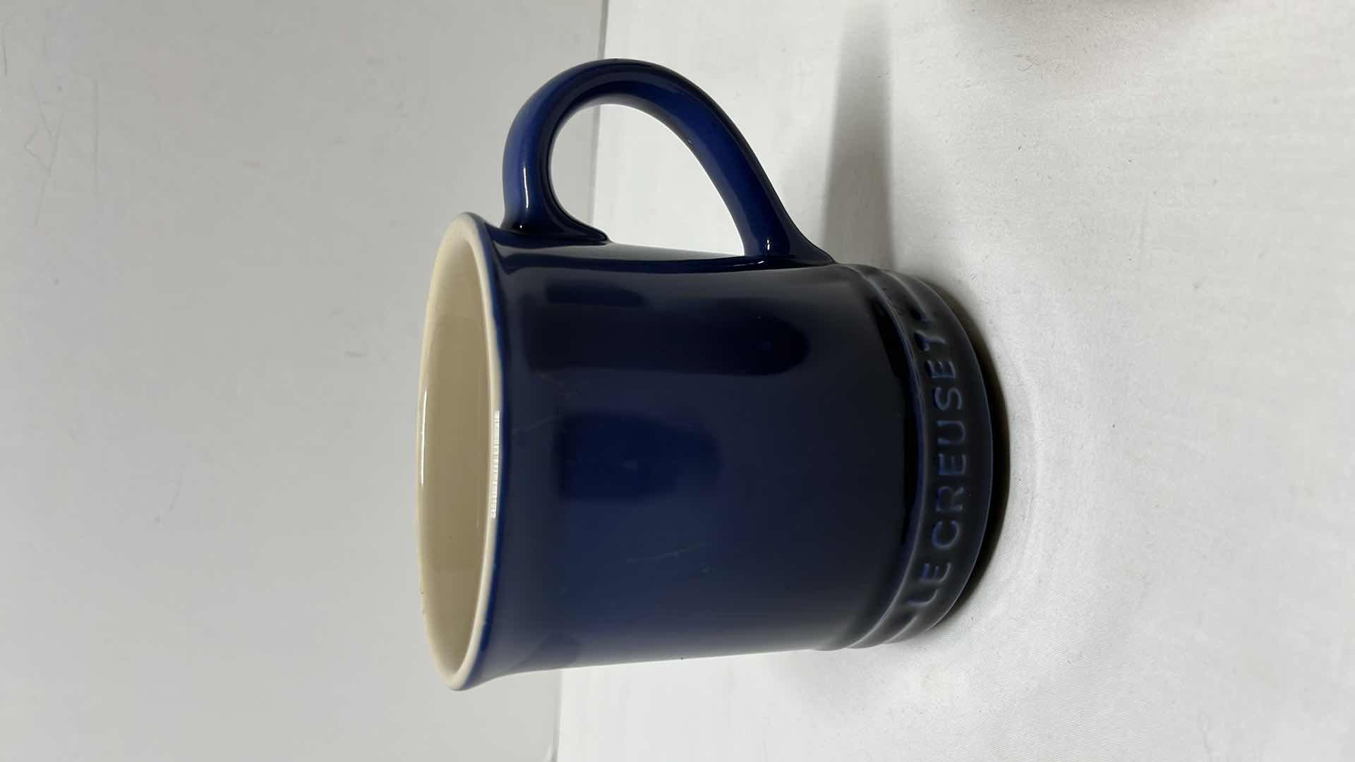 Photo 2 of LE CREUSET STONEWARE SET OF 3, 15 OZ MUGS