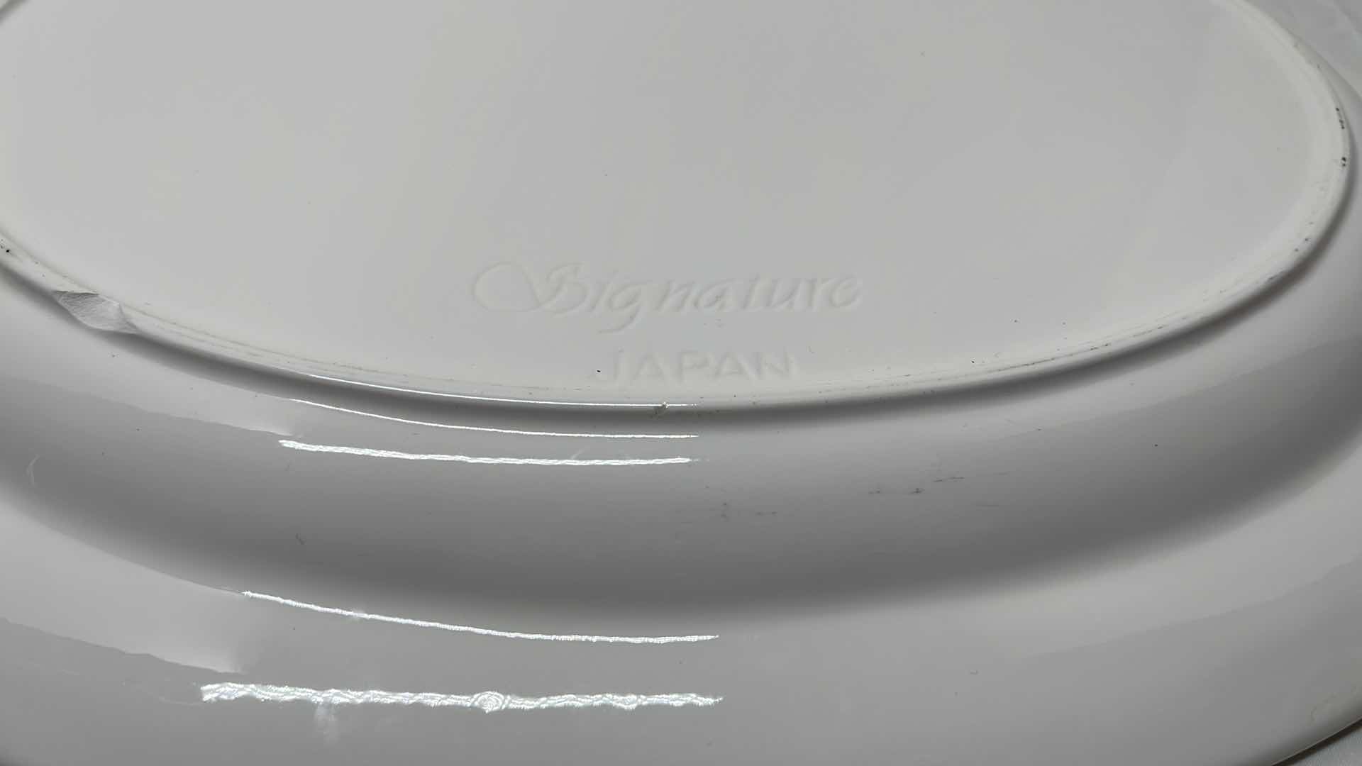 Photo 1 of 2 PCS CERAMIC SERVING PLATTERS 
BLACK 13.5” X 13.5”
WHITE 14.25” X 18”