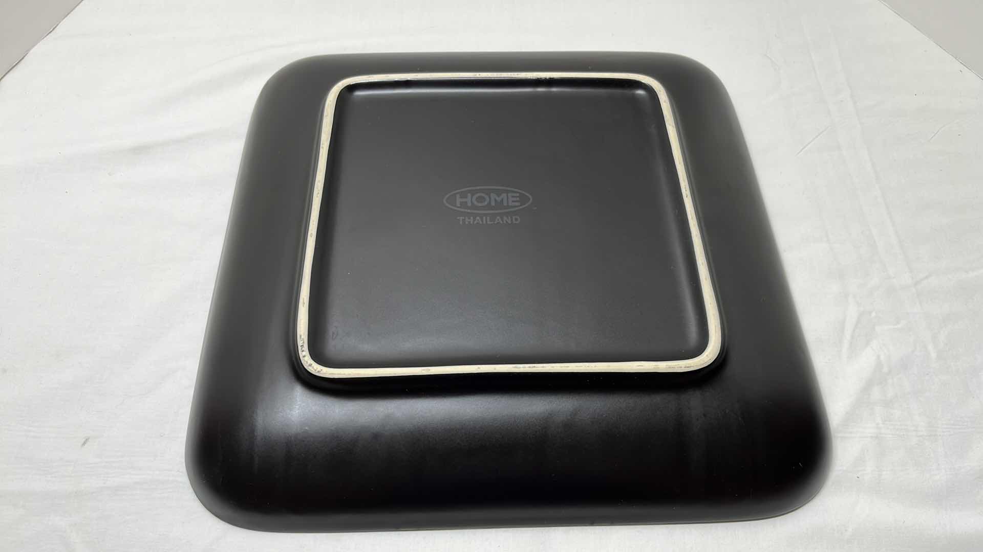 Photo 1 of 2 PCS CERAMIC SERVING PLATTERS 
BLACK 13.5” X 13.5”
WHITE 14.25” X 18”
