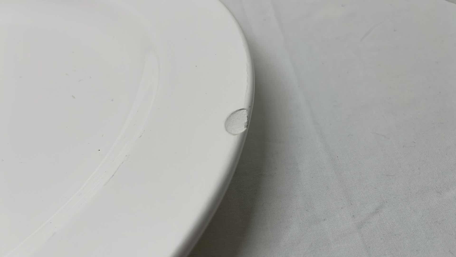 Photo 1 of 2 PCS CERAMIC SERVING PLATTERS 
BLACK 13.5” X 13.5”
WHITE 14.25” X 18”