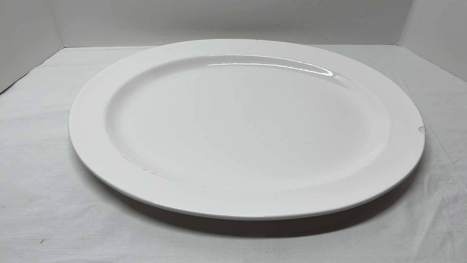 Photo 1 of 2 PCS CERAMIC SERVING PLATTERS 
BLACK 13.5” X 13.5”
WHITE 14.25” X 18”