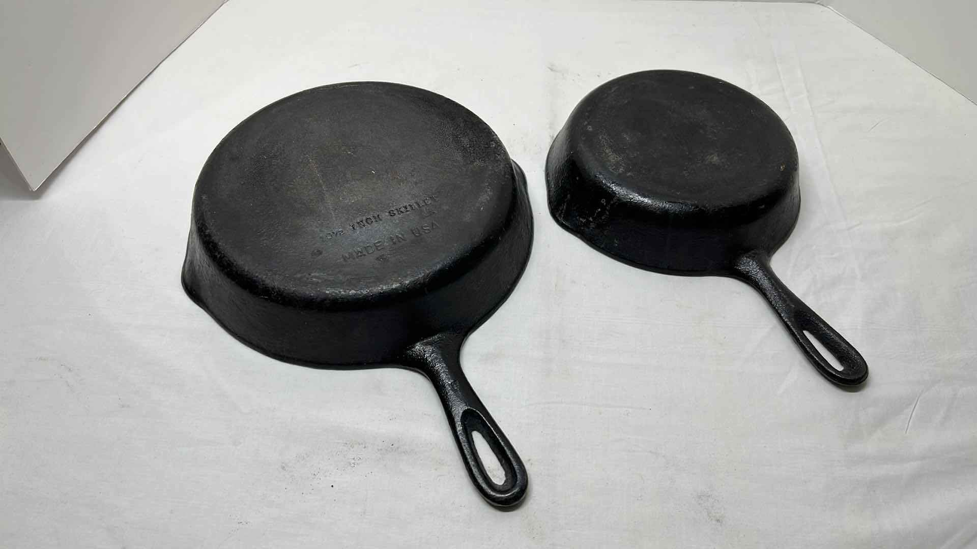 Photo 1 of 2 PCS CAST IRON SKILLETS 8.25” & 10.5”