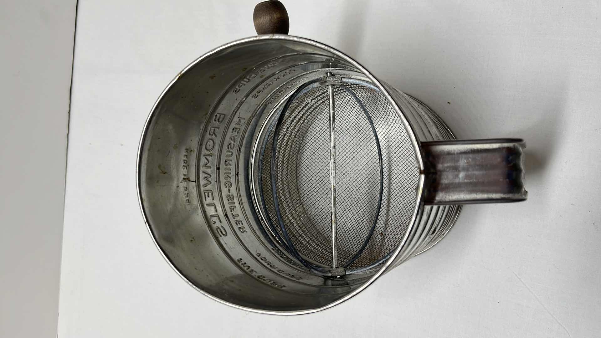 Photo 4 of LARGE MEASURING SIFTER, 35 OZ BLACK MEASURING CUP, 2 COOKIE CUTTERS, 3 LOAF PANS, (4) 3.5” ROUND DOUGH CUTTERS, MEASURING SPOON SET, ROLLING STICK AND DOUGH BLENDER