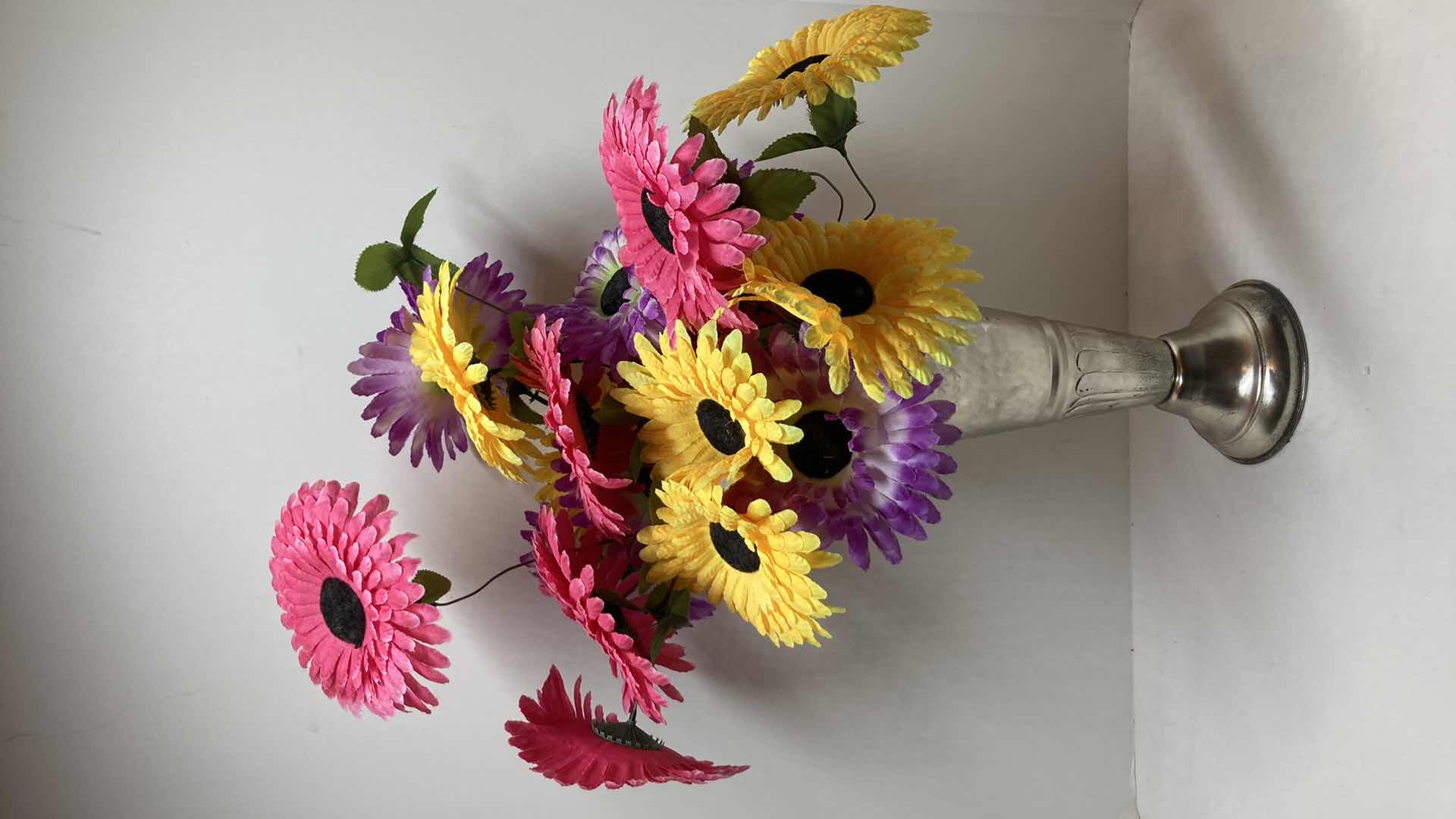 Photo 1 of MULTI COLORED DAISIES W CHROME FINISH METAL VASE 5” X 11”