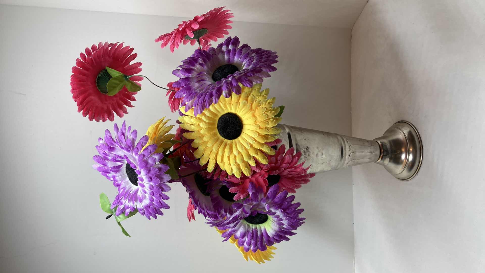 Photo 1 of MULTI COLORED DAISIES W CHROME FINISH METAL VASE 5” X 11”