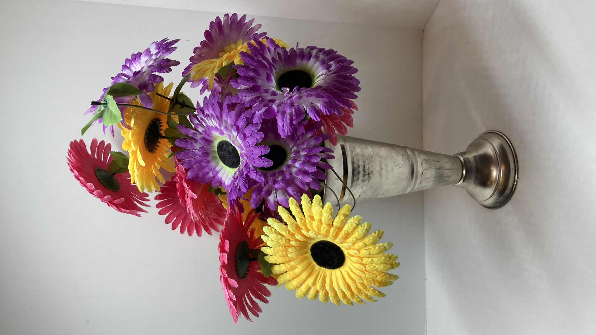 Photo 1 of MULTI COLORED DAISIES W CHROME FINISH METAL VASE 5” X 11”
